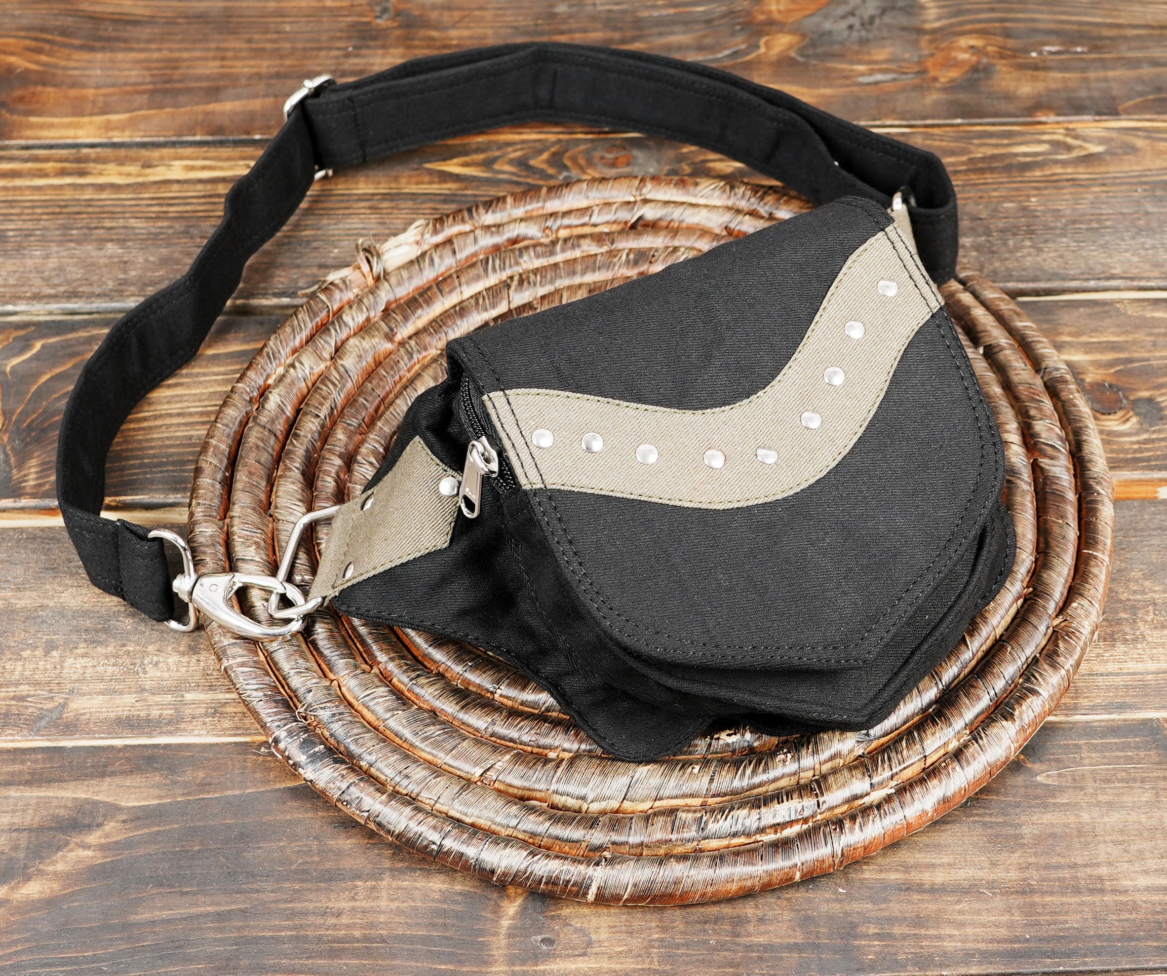 Compact black canvas fanny pack, a secure and lightweight option for safe travel in the USA.