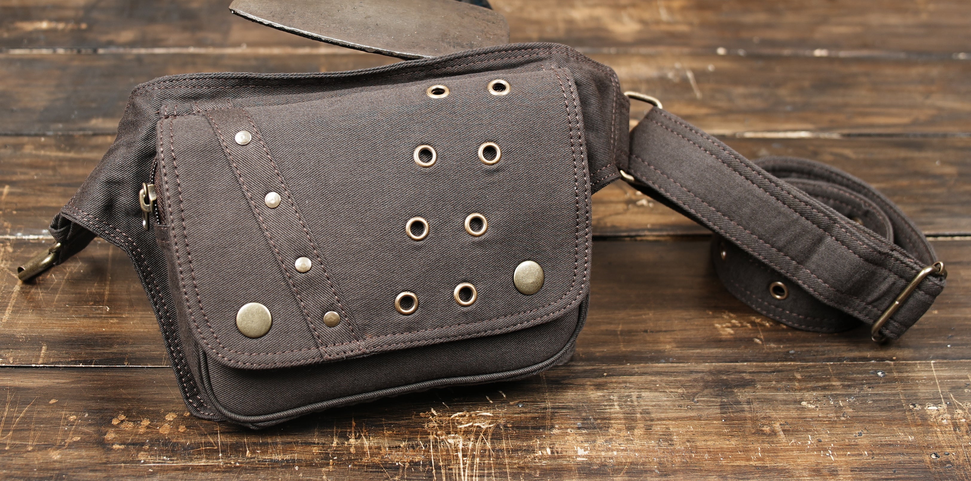 Black waist pack with snap flap pocket and everyday carry design