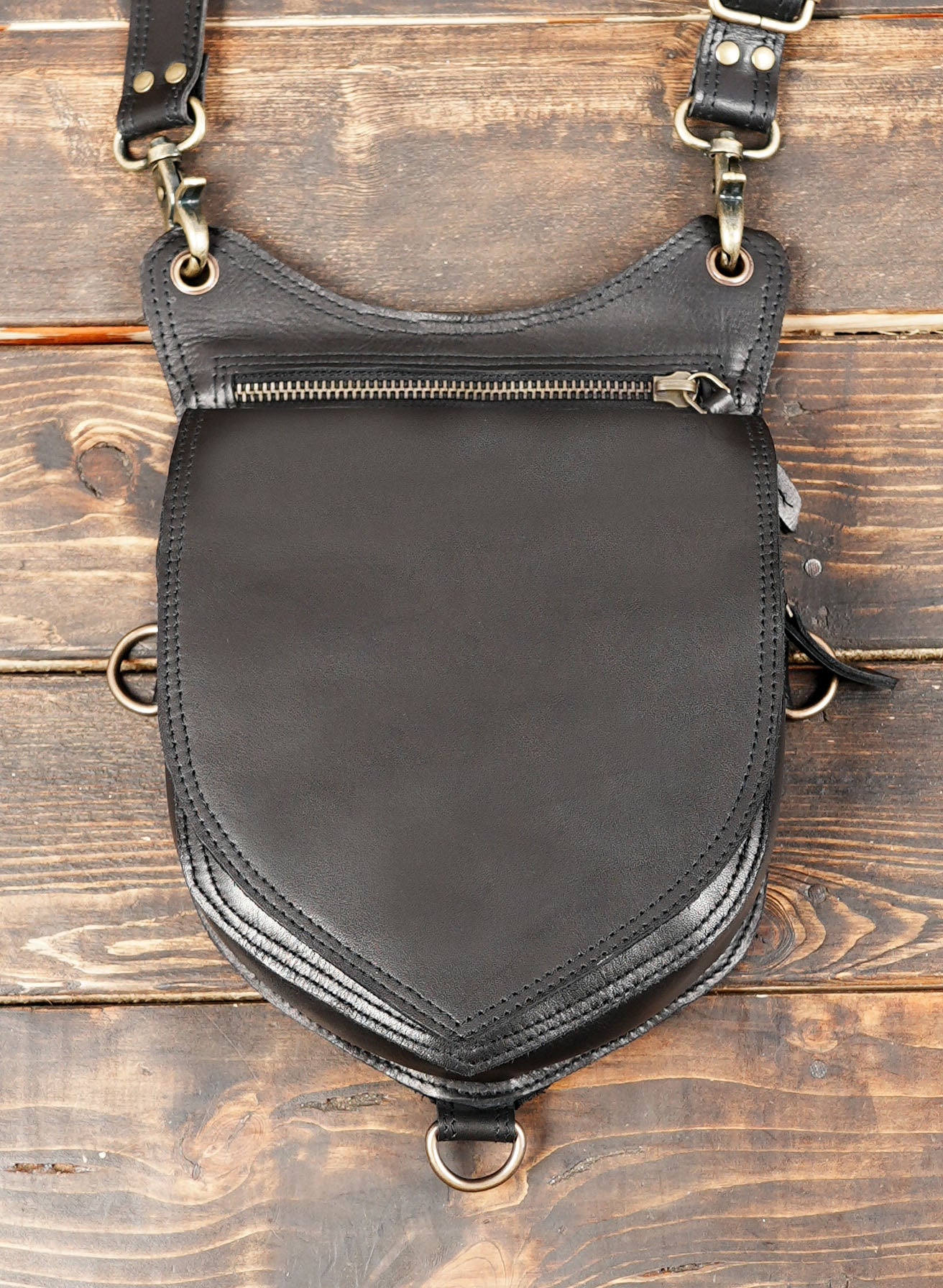 Adjustable leather side holster with secure buckle system