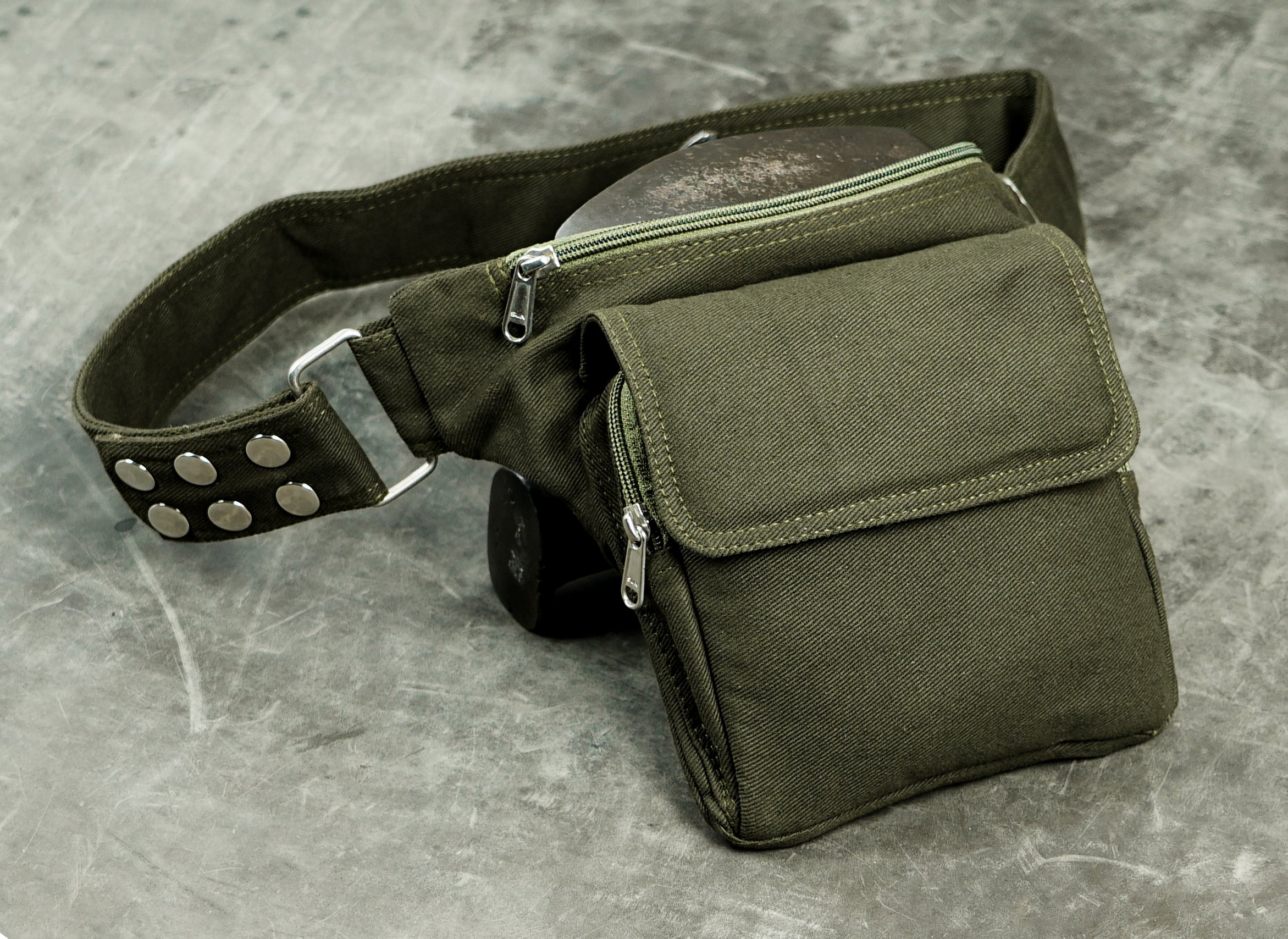 Olive canvas hip bag with snap stud belt and metal slider adjuster