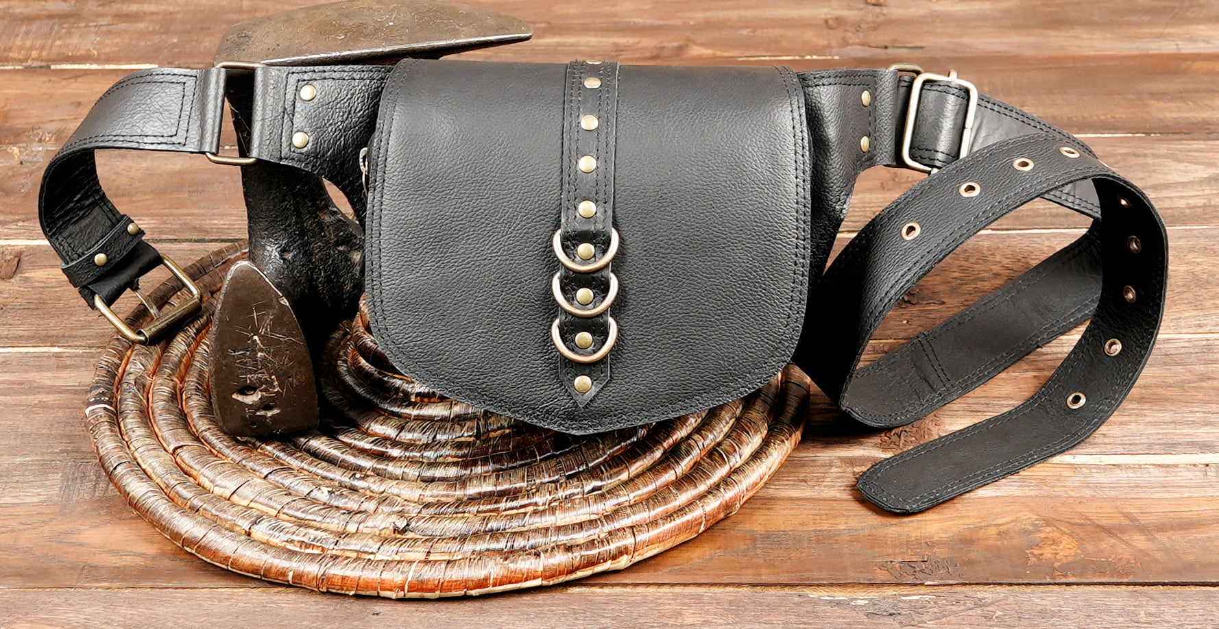 Western-style black leather belt bag with brass studs and durable waist strap