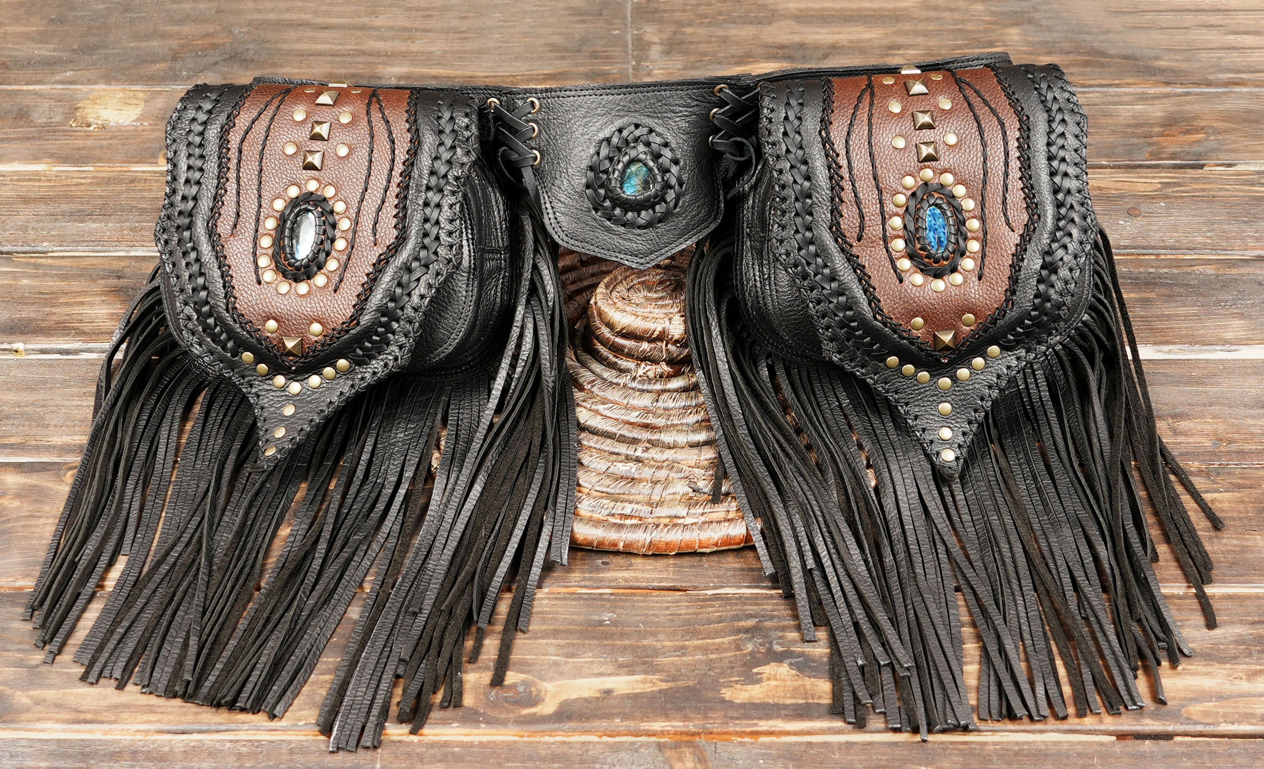 Leather waist belt with tribal inspired design, fringe trim, and stone accents