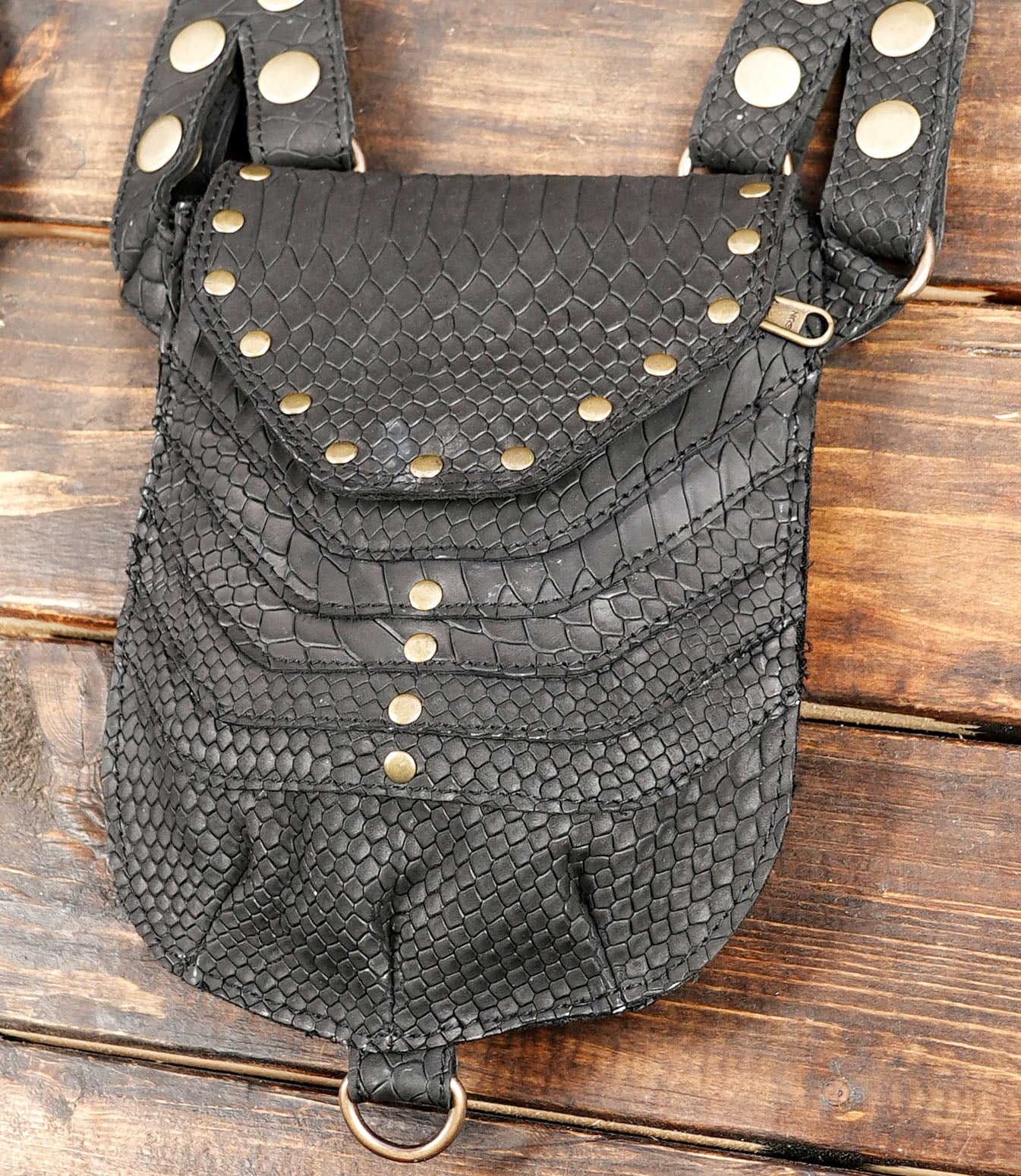 Adjustable leather harness with twin utility bags and decorative rivets