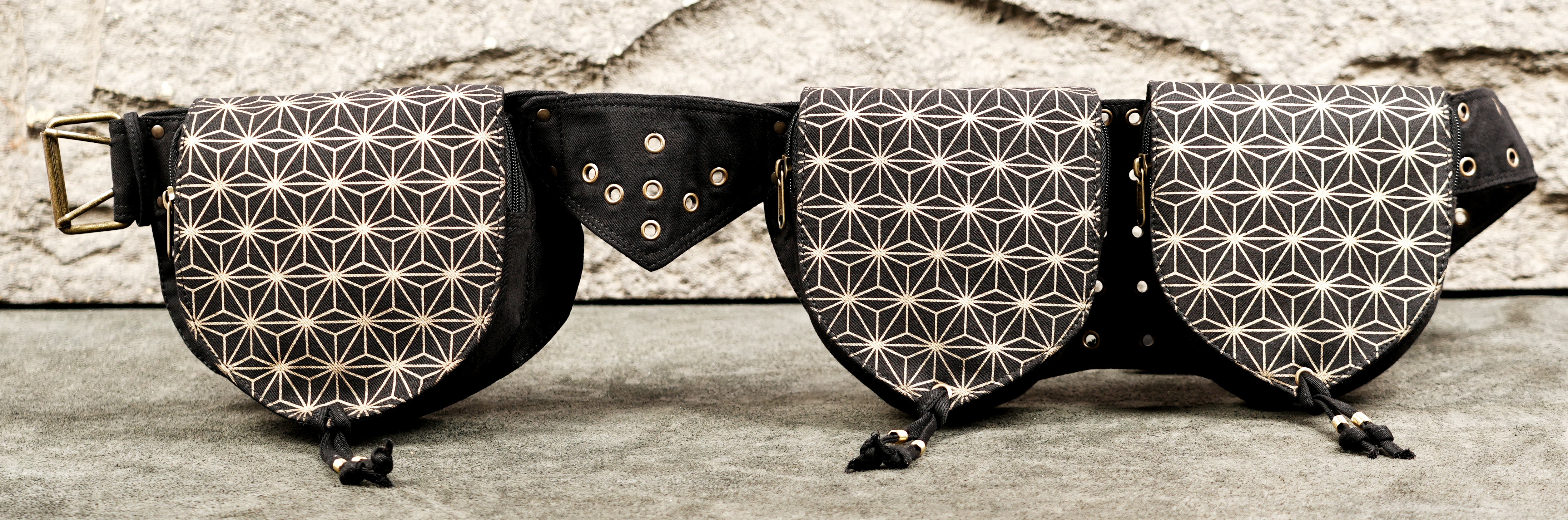 Burning Man style hip pack with geometric star pattern and metal buckle