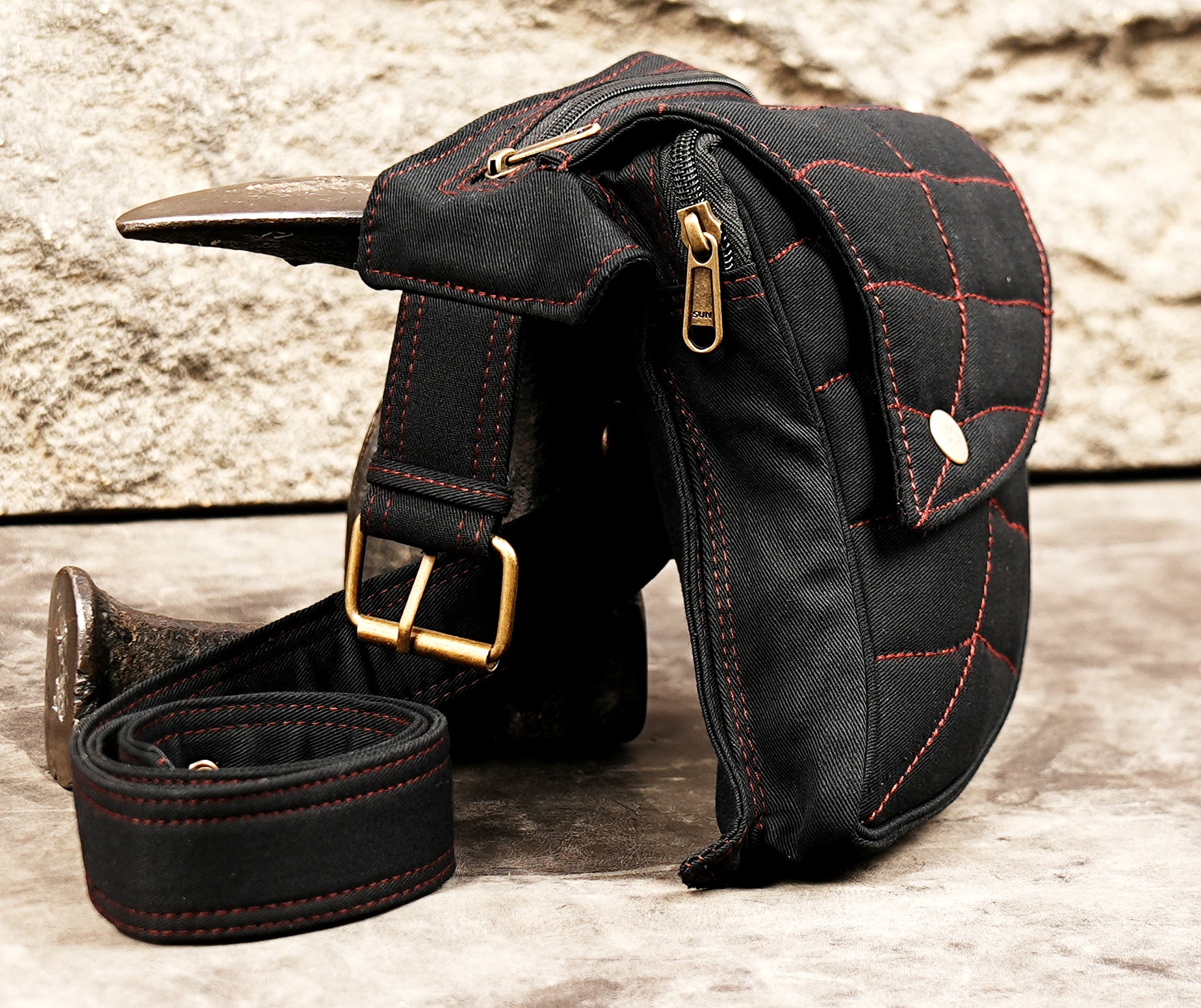 Contoured side hip bag with adjustable eyelet belt for concerts and travel