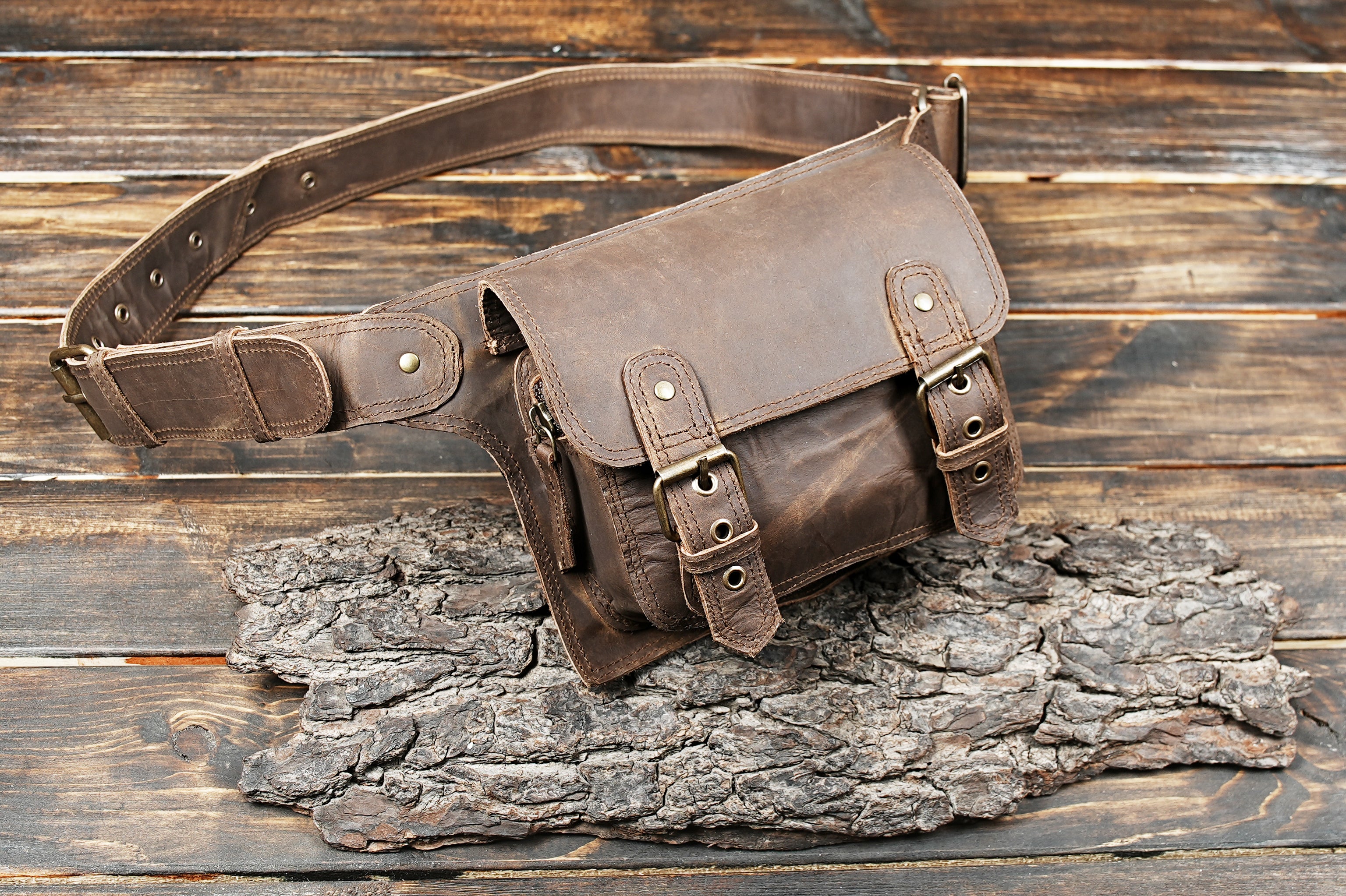 Rugged brown leather hip bag with adjustable strap