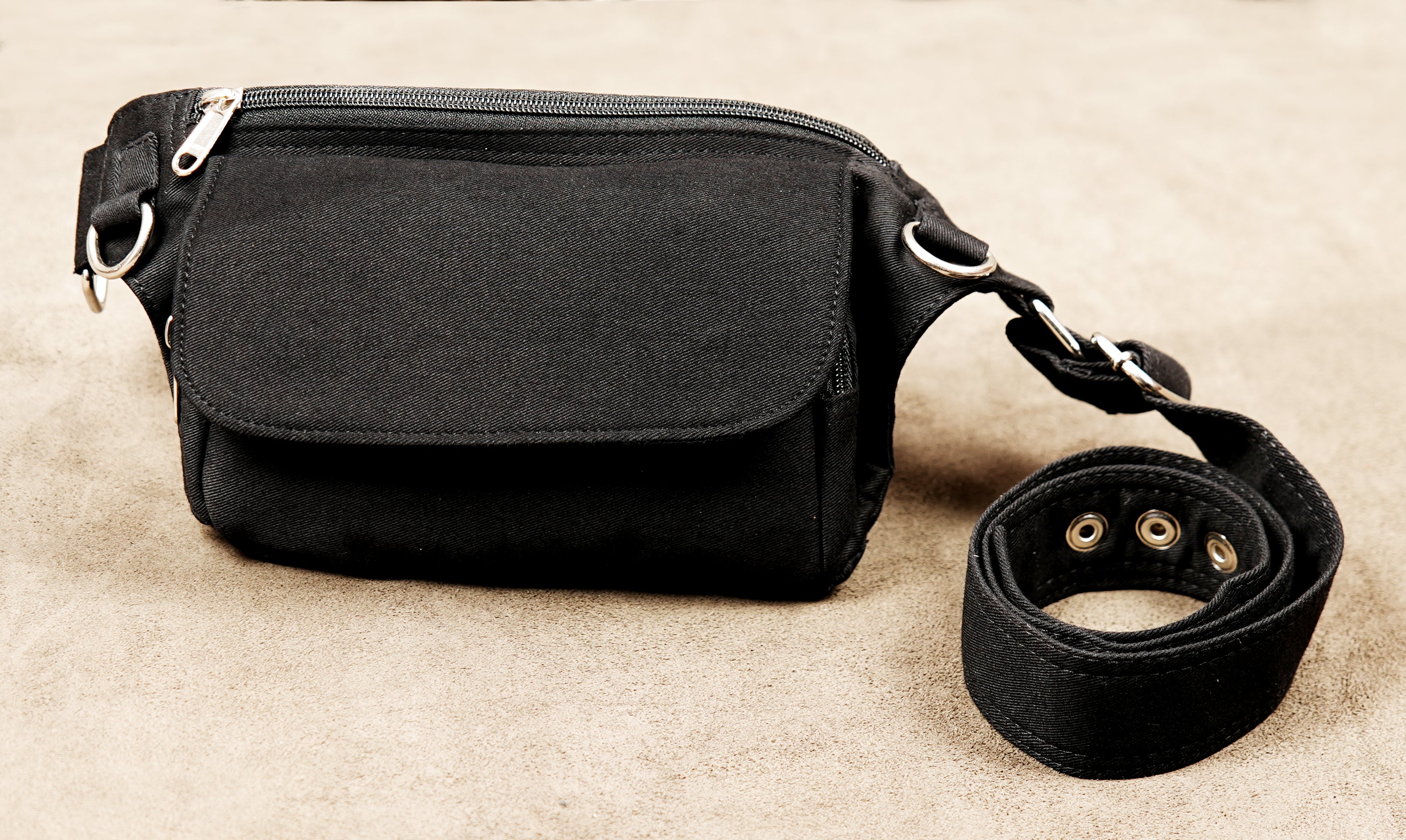 Practical black utility pouch worn around the hips or waist for daily carry.
