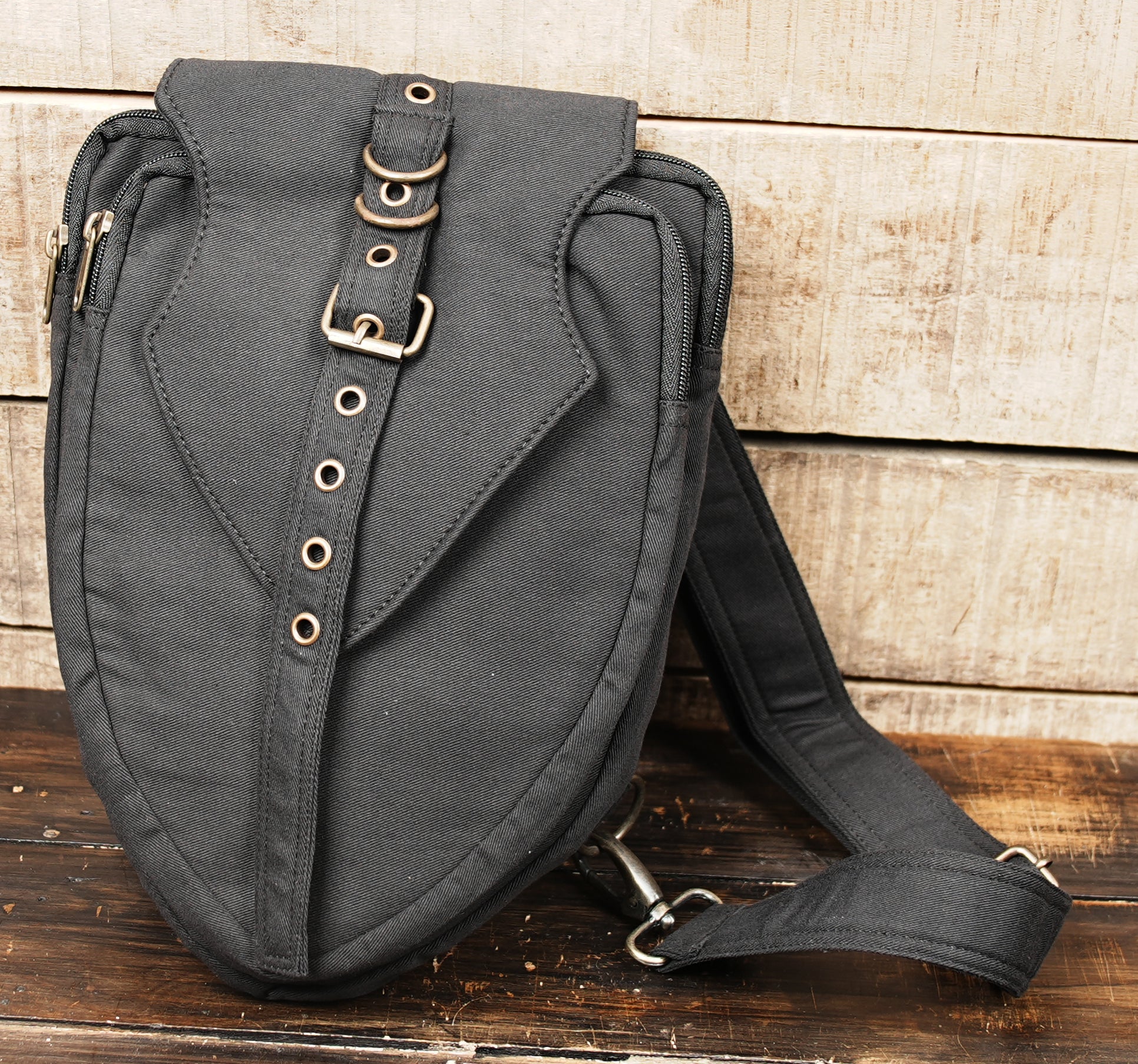 Lightweight black cotton sling bag with adjustable shoulder strap