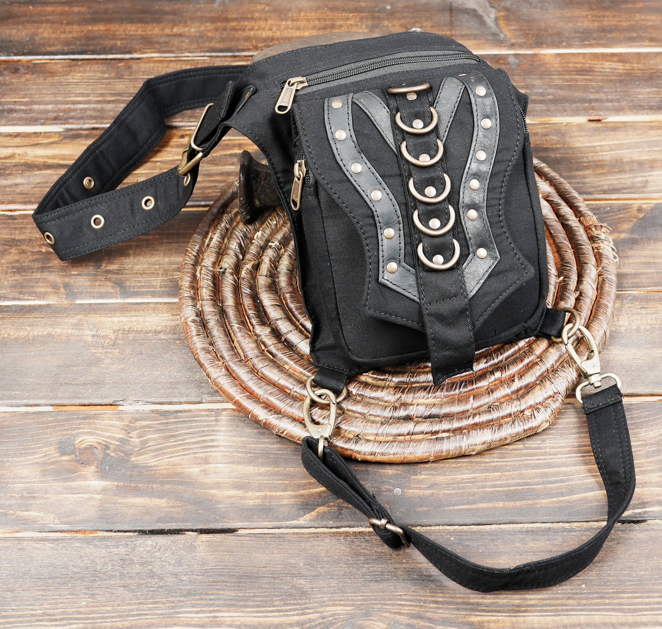 Unisex cotton canvas hip and thigh bag with multi-pocket zippered storage for travel and festivals.