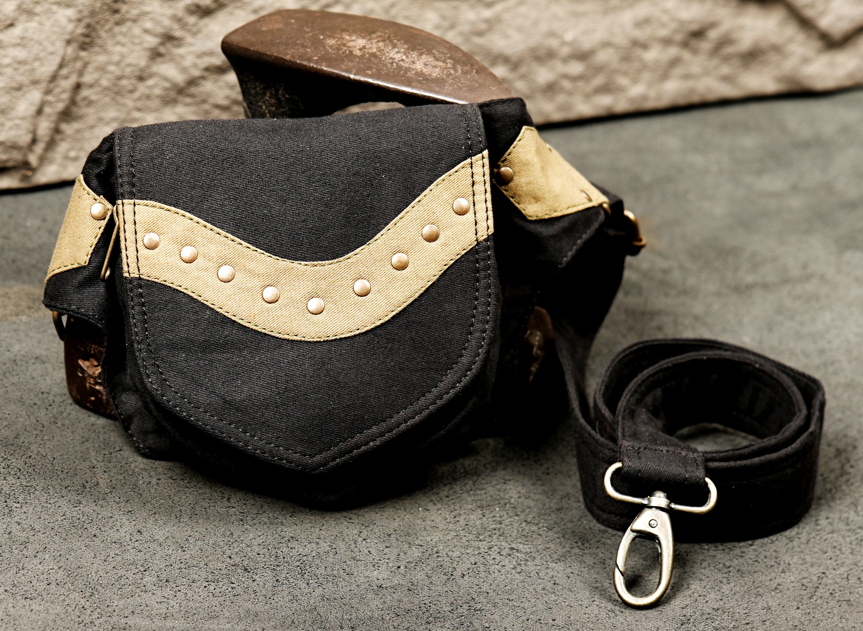 Detail shot of the metal roller buckle and adjustment hardware on this stylish utility belt bag.