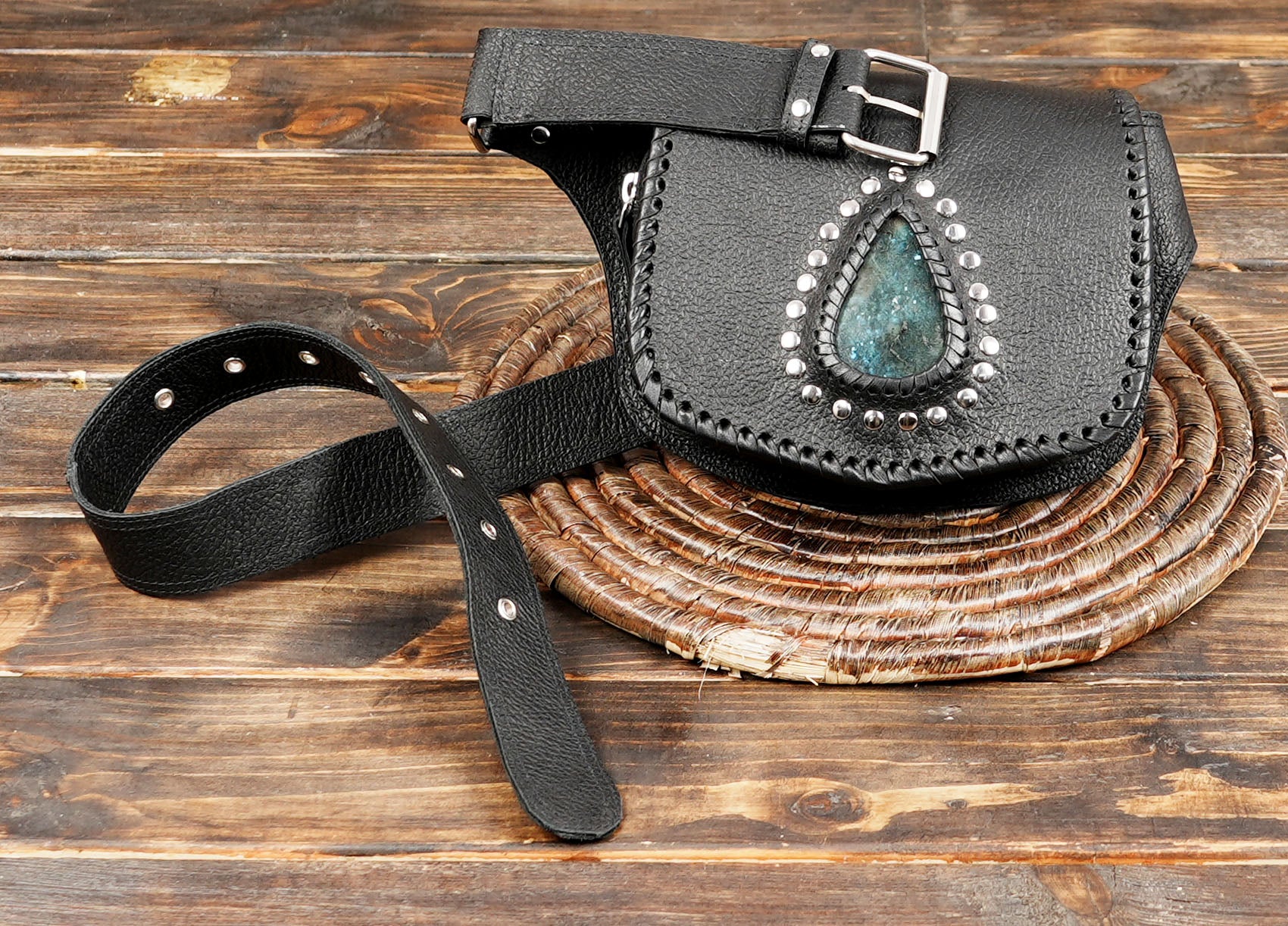 Black festival belt bag with gemstone accent and adjustable strap for men and women