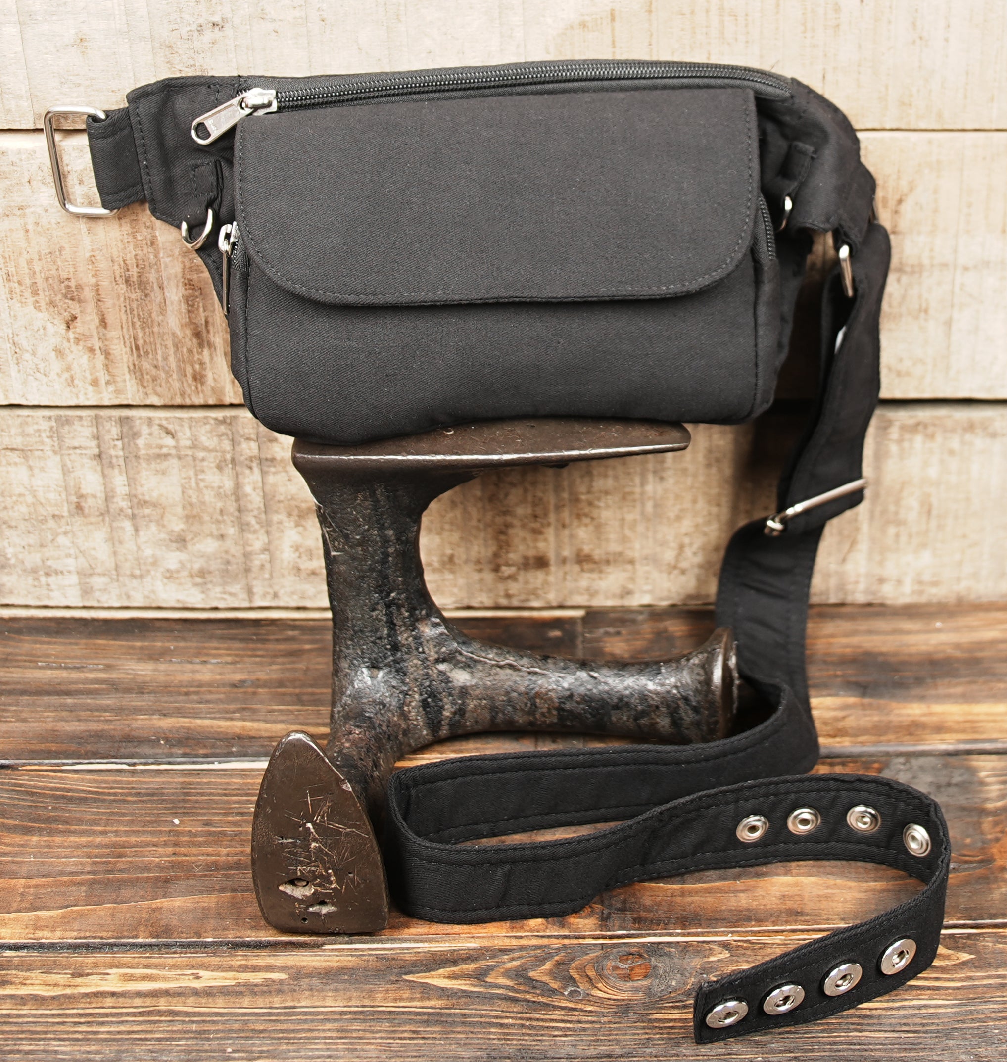 Black fanny pack with D-ring hardware and adjustable strap
