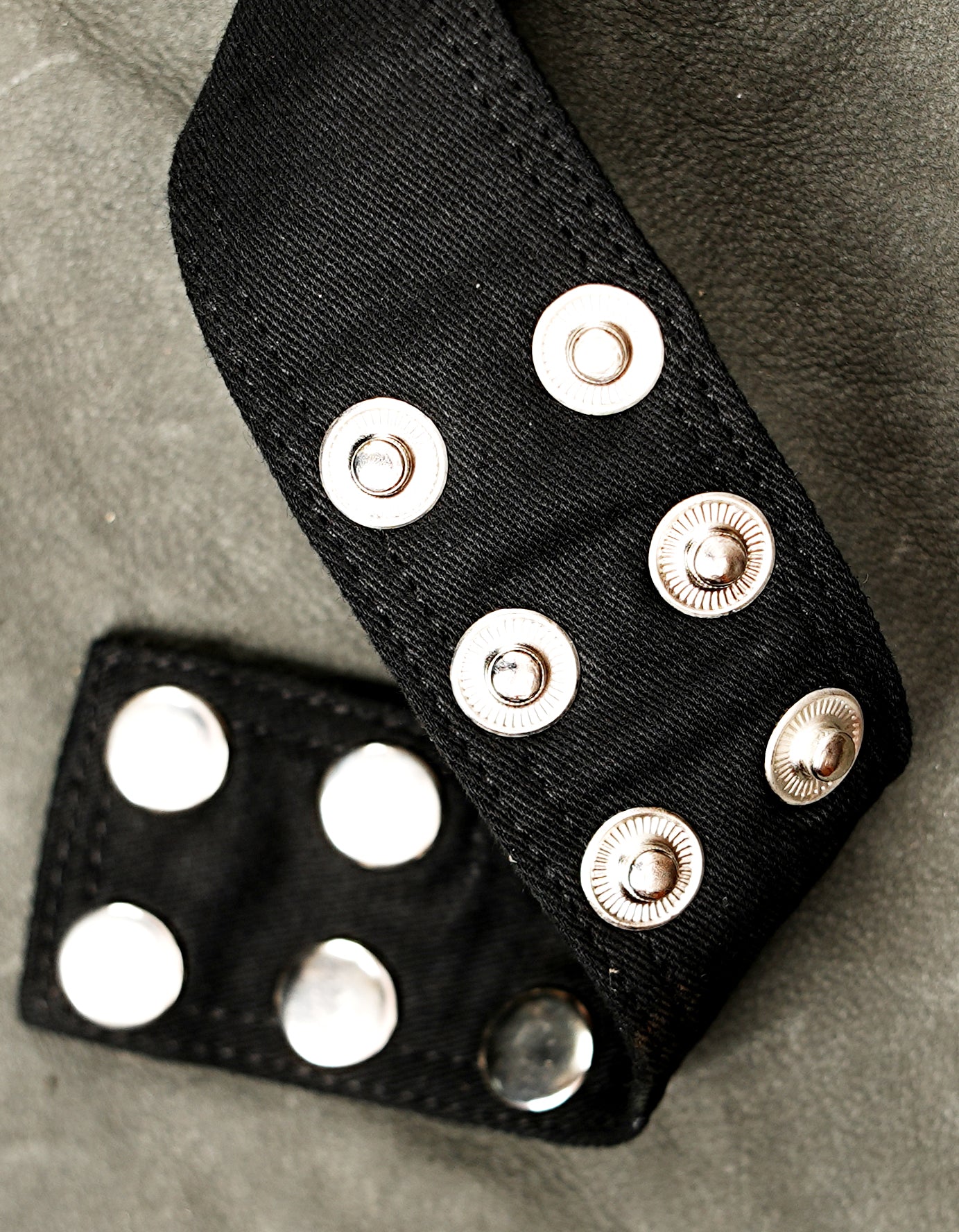 Unisex black cotton utility belt with multiple storage pockets for music festivals and outdoor events.

