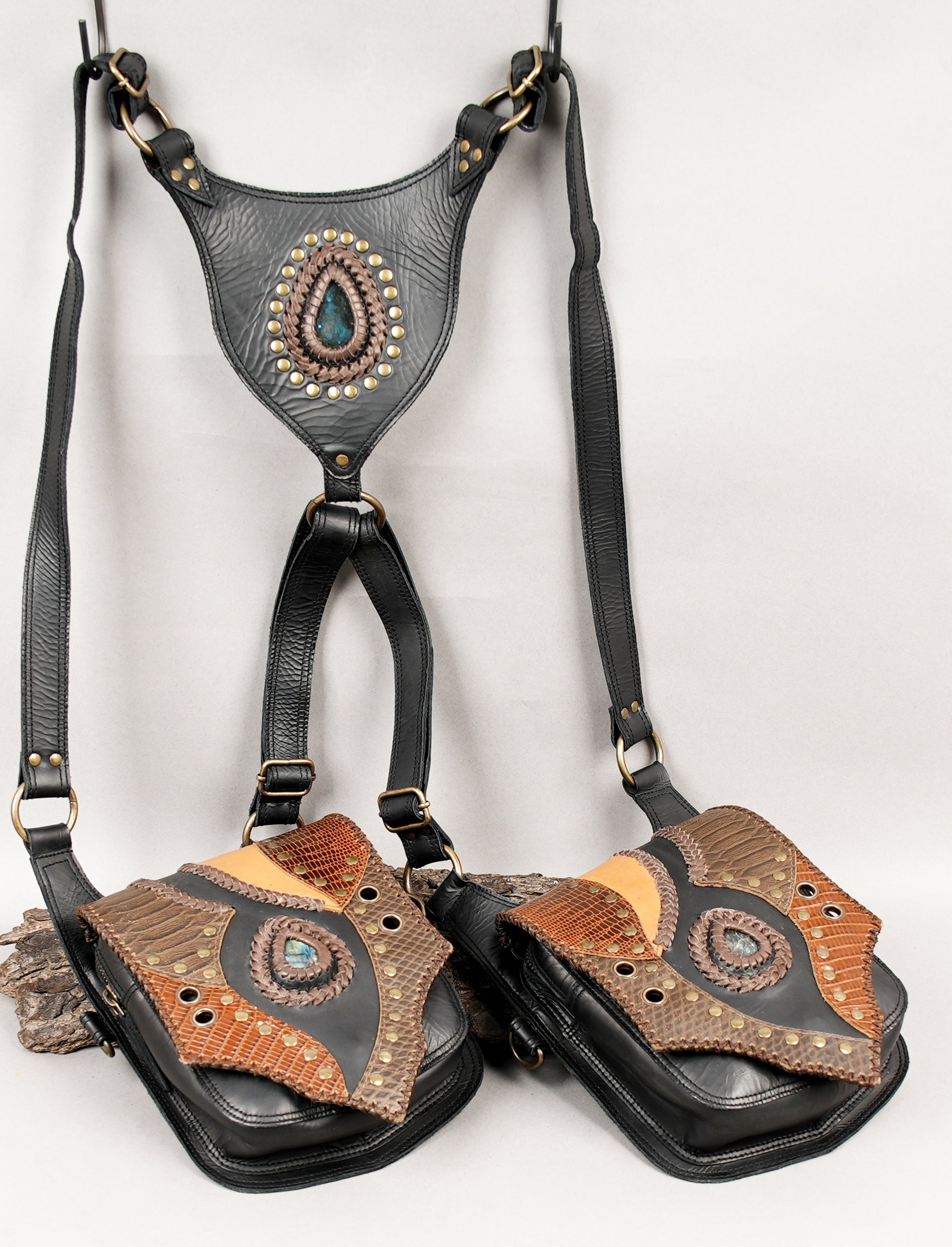 Two-pouch leather harness bag with patterned flap design