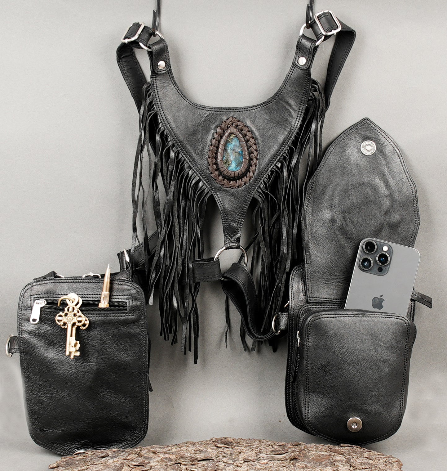 Artisan black leather festival holster with dual pouches and fringe detail