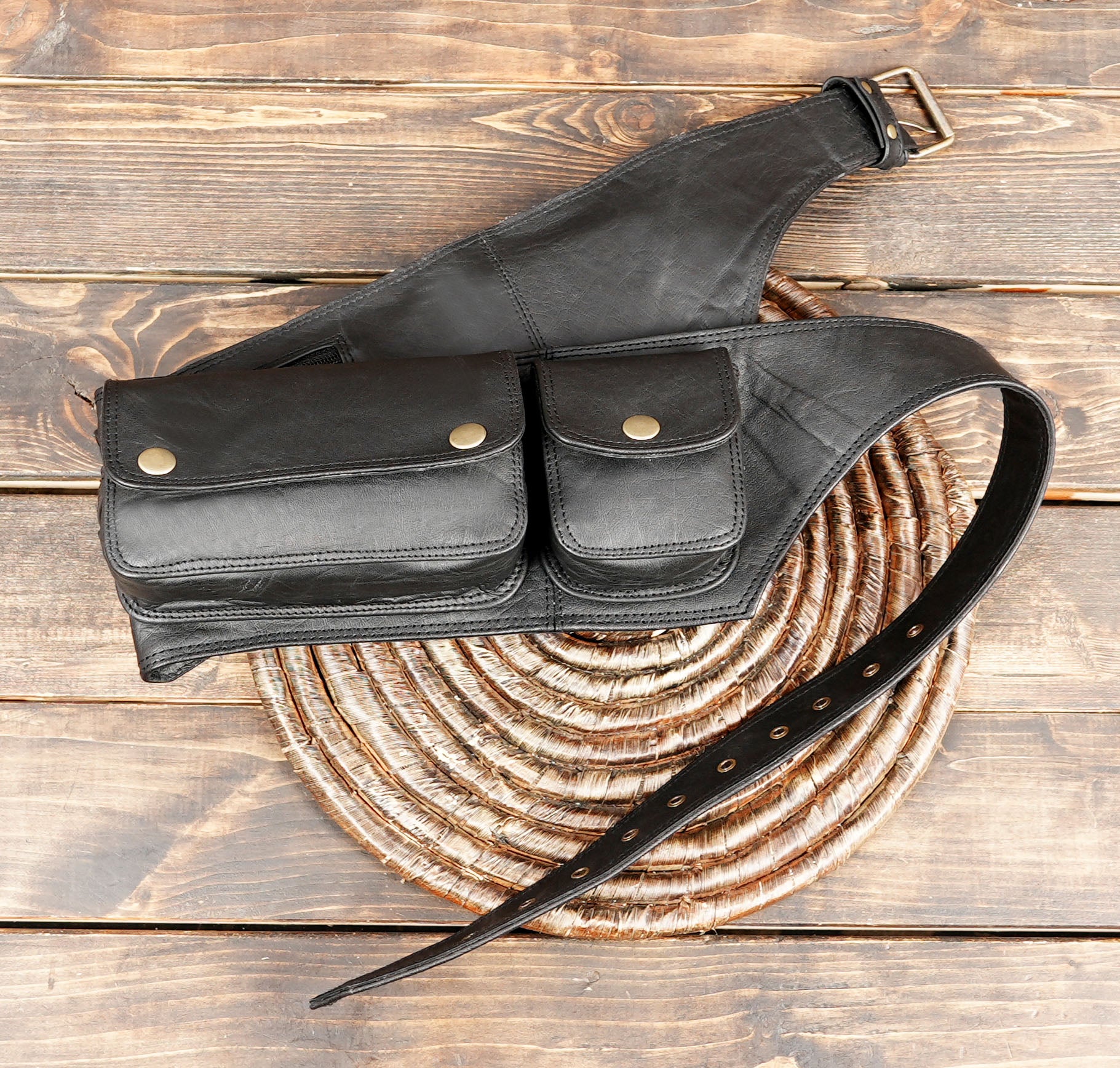 Made from high-quality genuine leather, it features five spacious pouches, providing excellent storage for essentials like phone, wallet, keys, money, or travel gear.