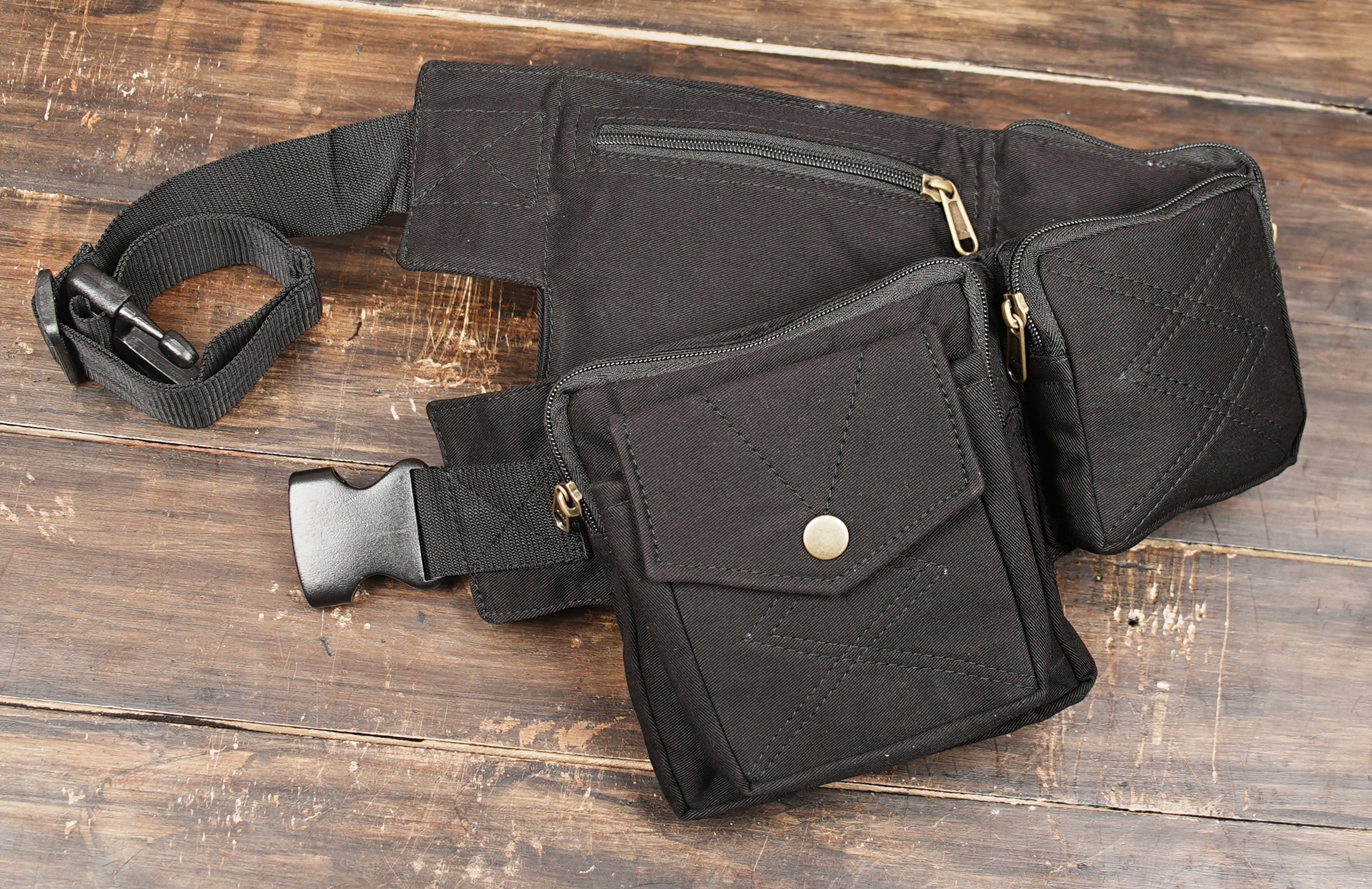 Black festival utility bag with multiple pockets and hands free storage