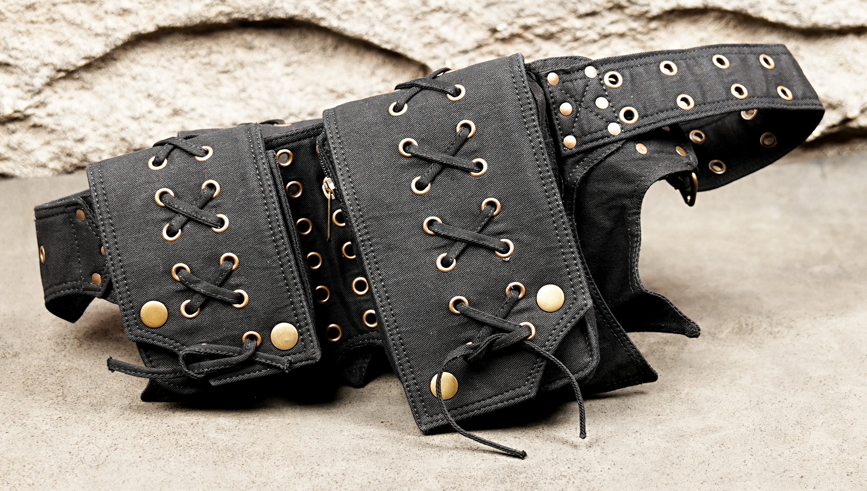 Laced canvas fanny pack with multiple utility compartments