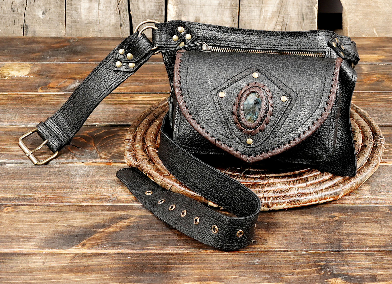 Beautifully handcrafted black leather waist belt with a unique gemstone centerpiece and secure pocket