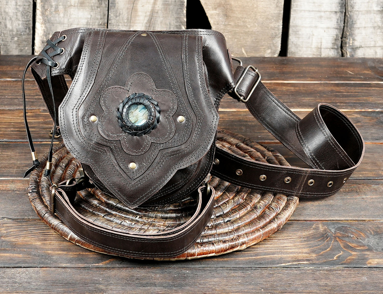 Vintage-inspired leather utility belt with adjustable waist strap and front pouch.