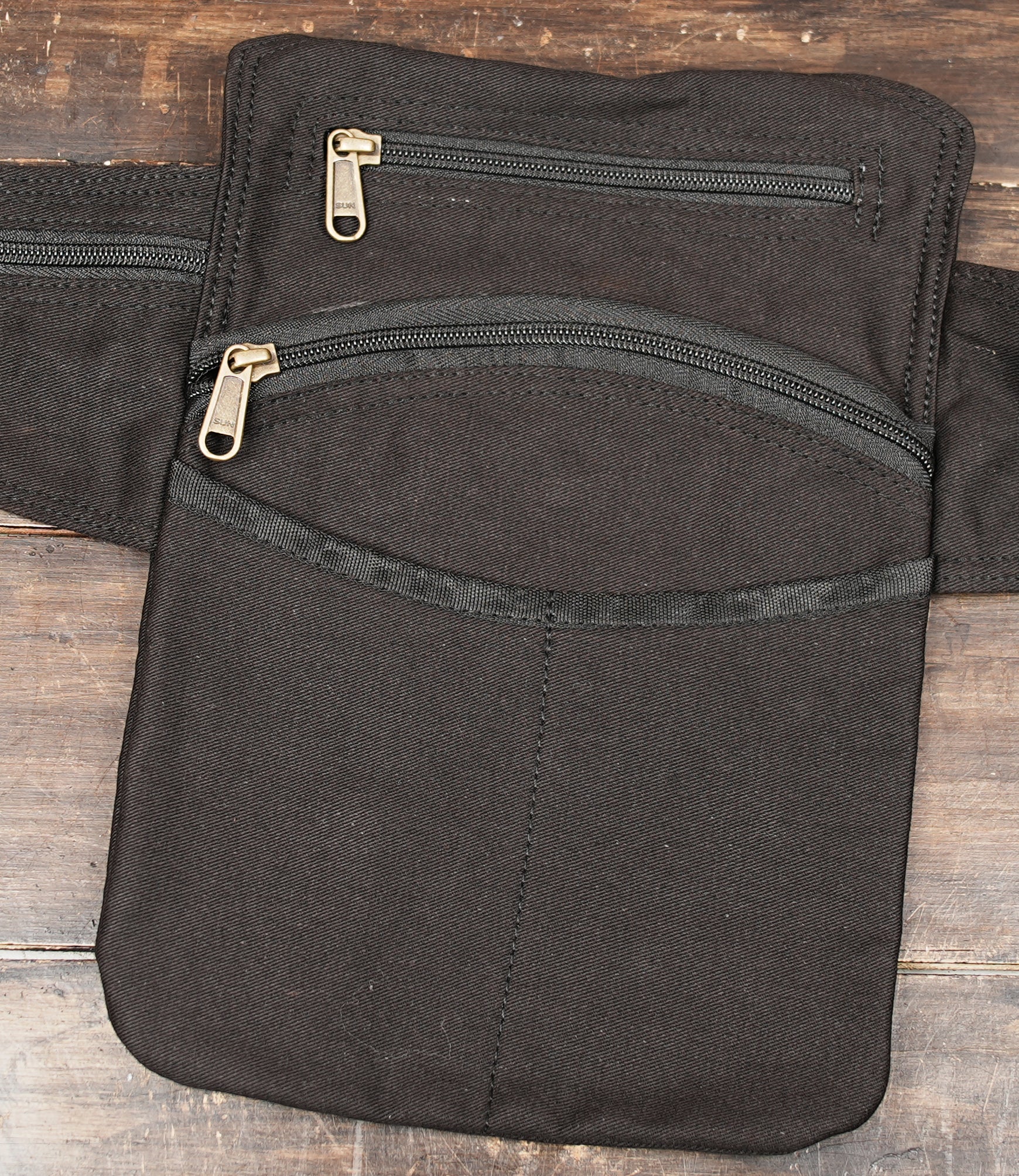 Unisex black belt bag with multi pocket design and secure zip closure