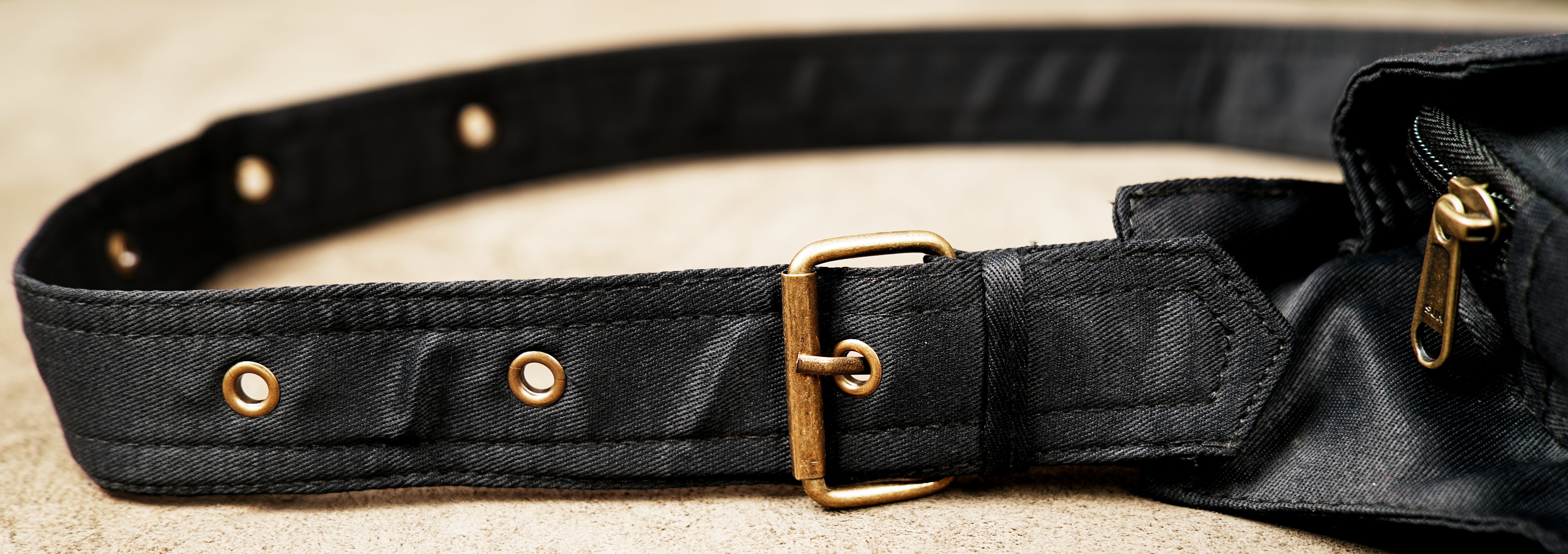Alternative fashion black canvas hip pouch with brass accents