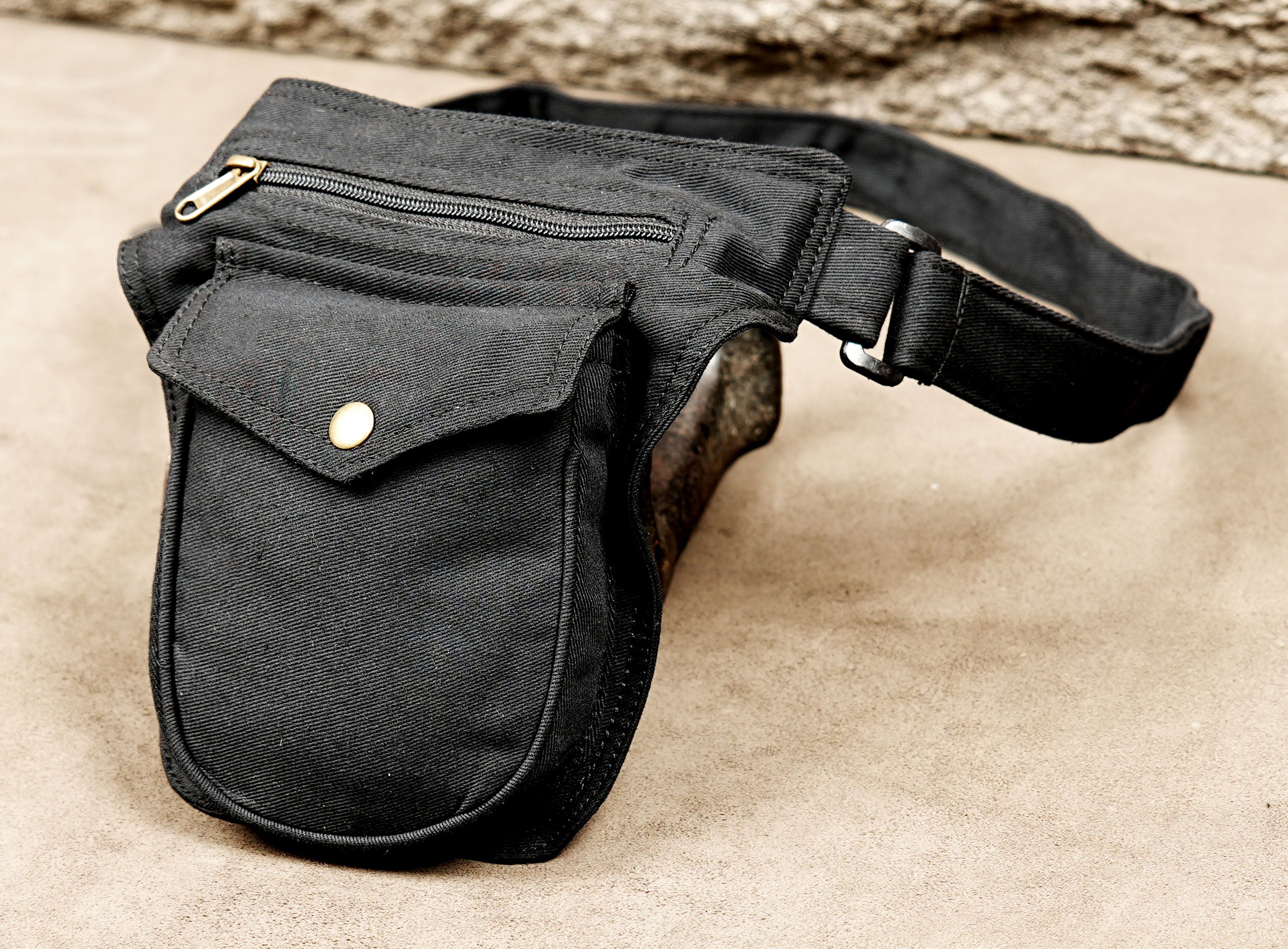 Black canvas belt bag with brass hardware details