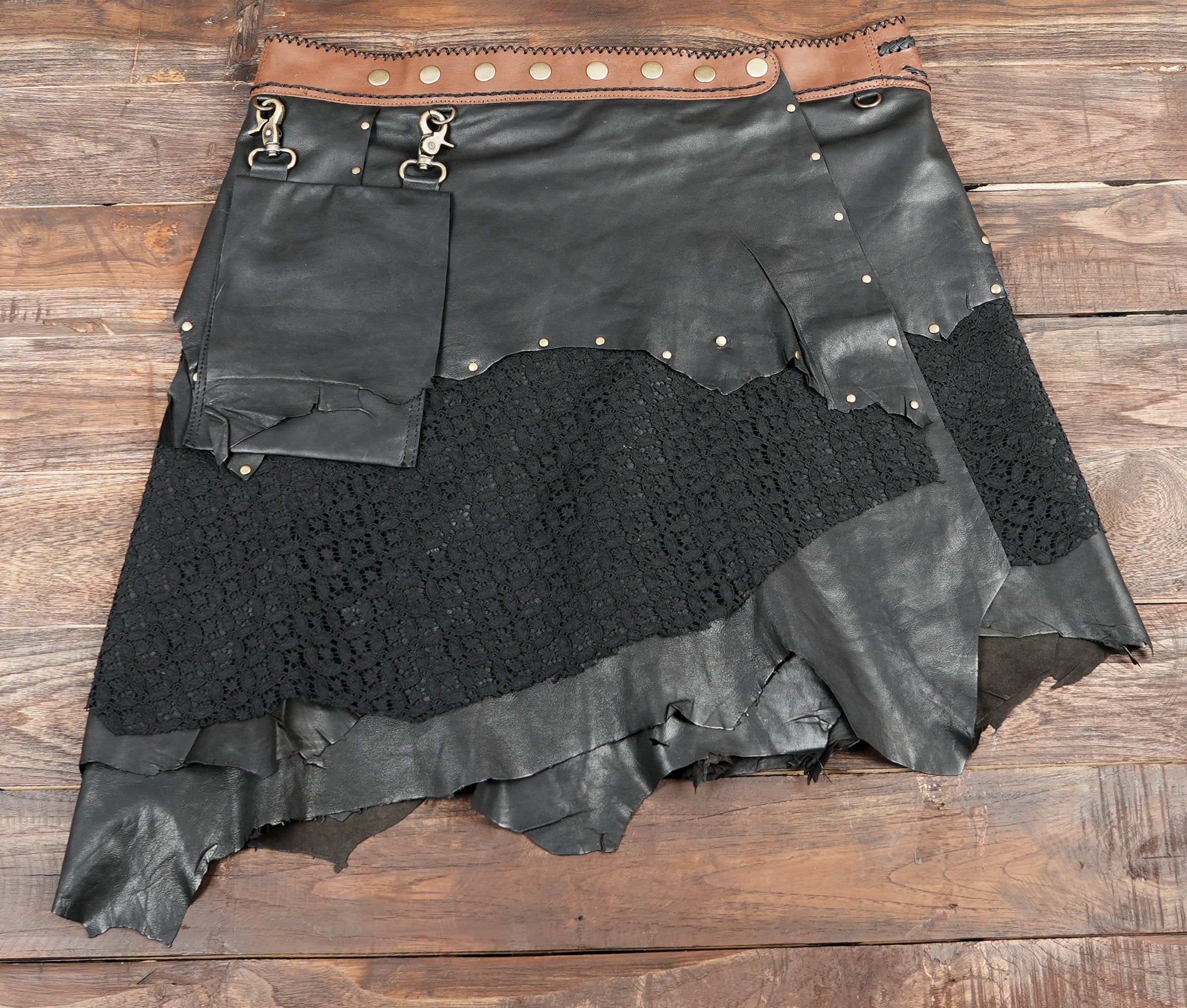 Handmade rustic skirt with black lace, leather, and decorative stone accent