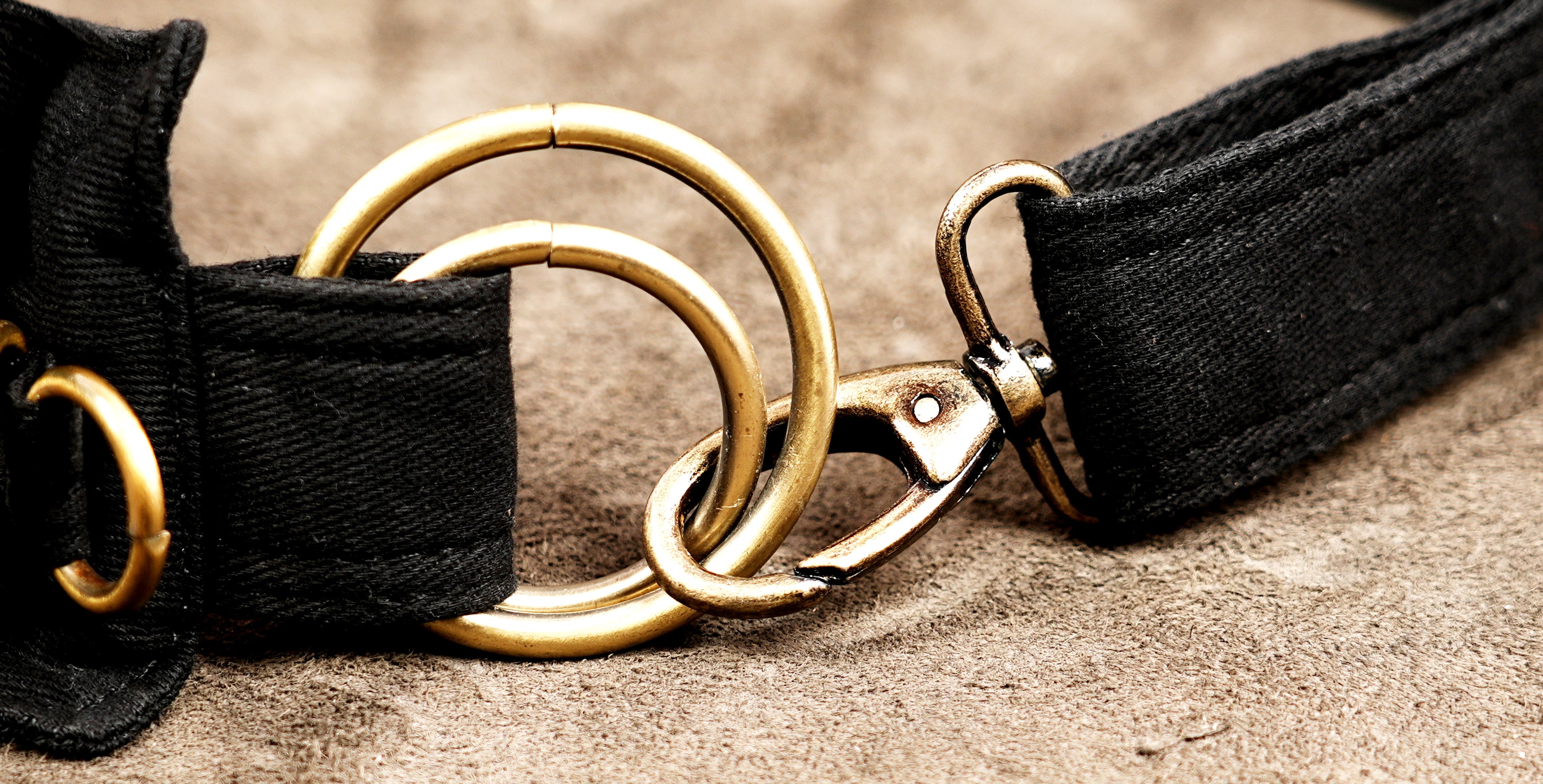 Alternative fashion black canvas hip bag with brass accents