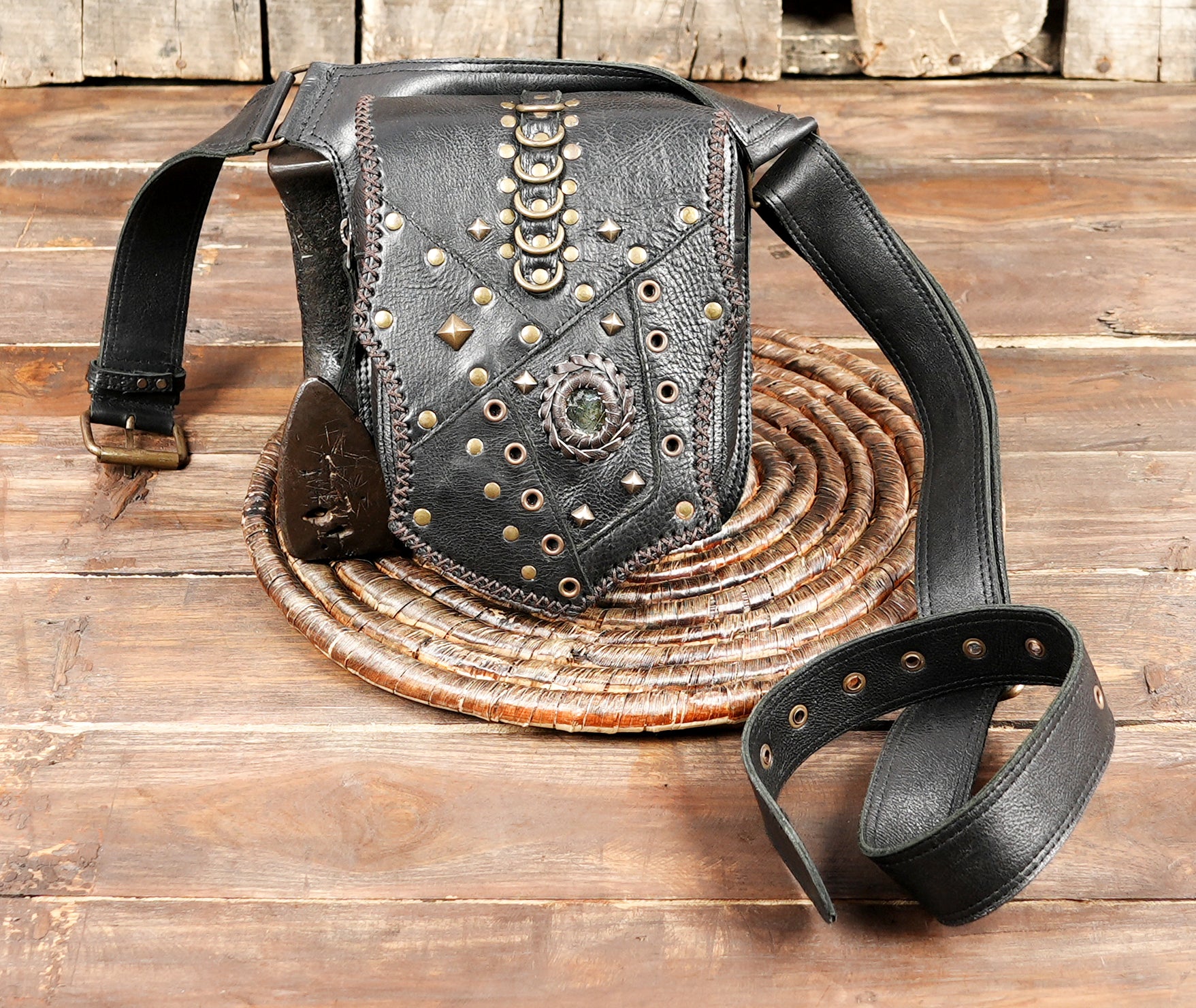 Handcrafted leather waist belt with decorative rivets and pouch