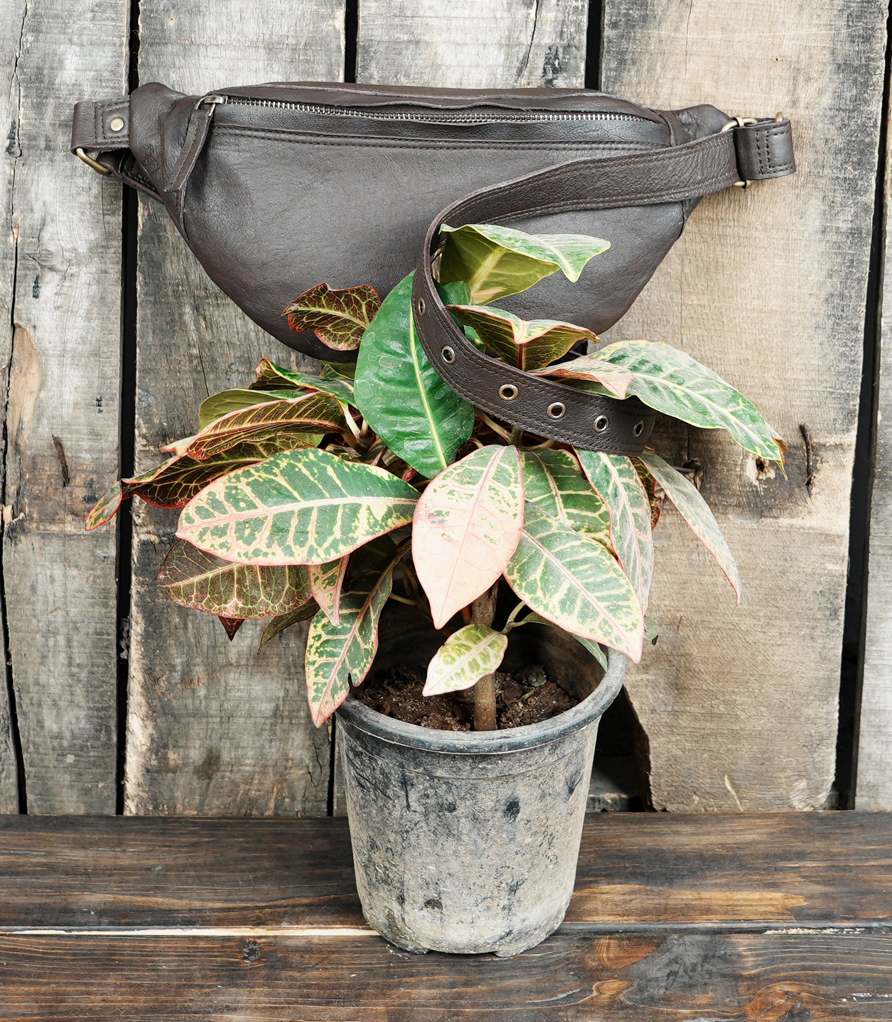 Durable leather waist belt with secure fastening and storage pocket