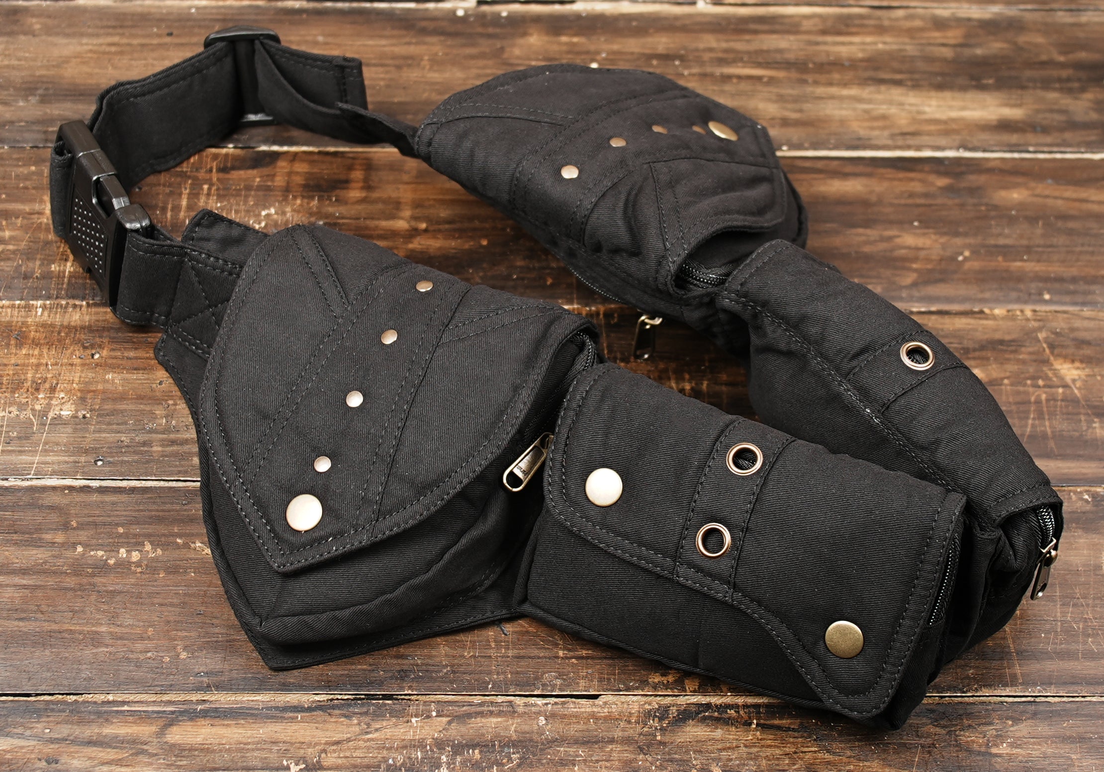Utility waist pack with multiple compartments and antique brass hardware