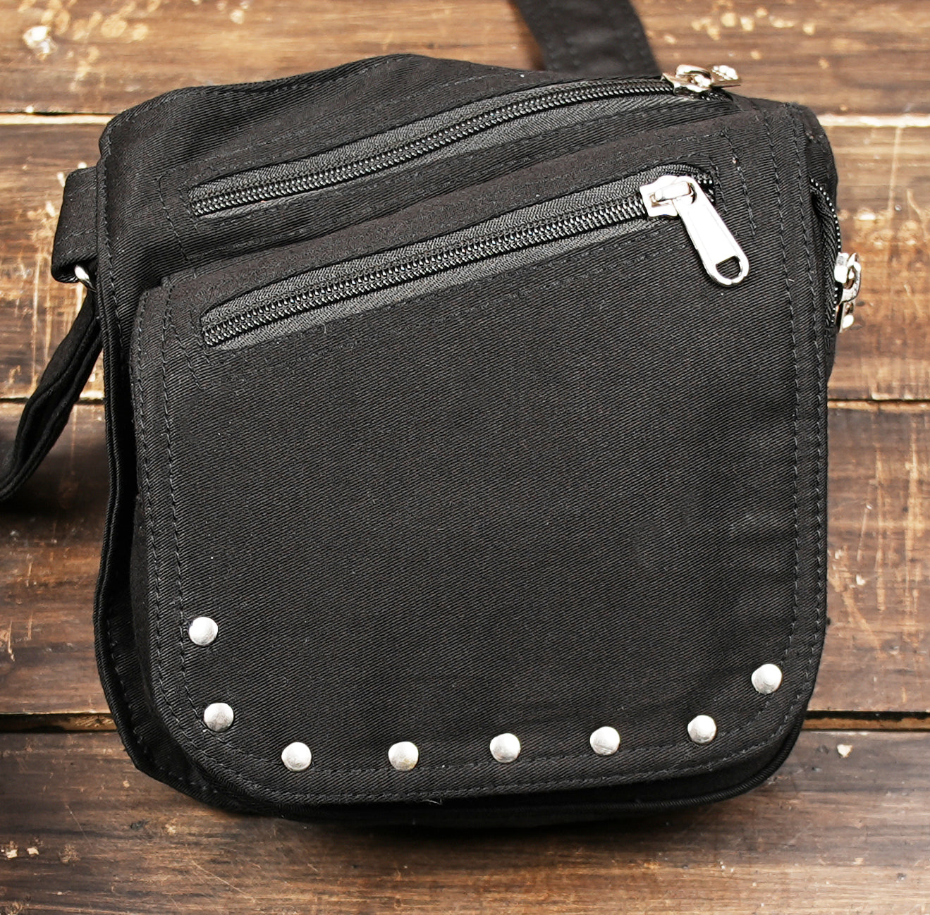 Adjustable double shoulder bag with secure zippered compartments and stud details