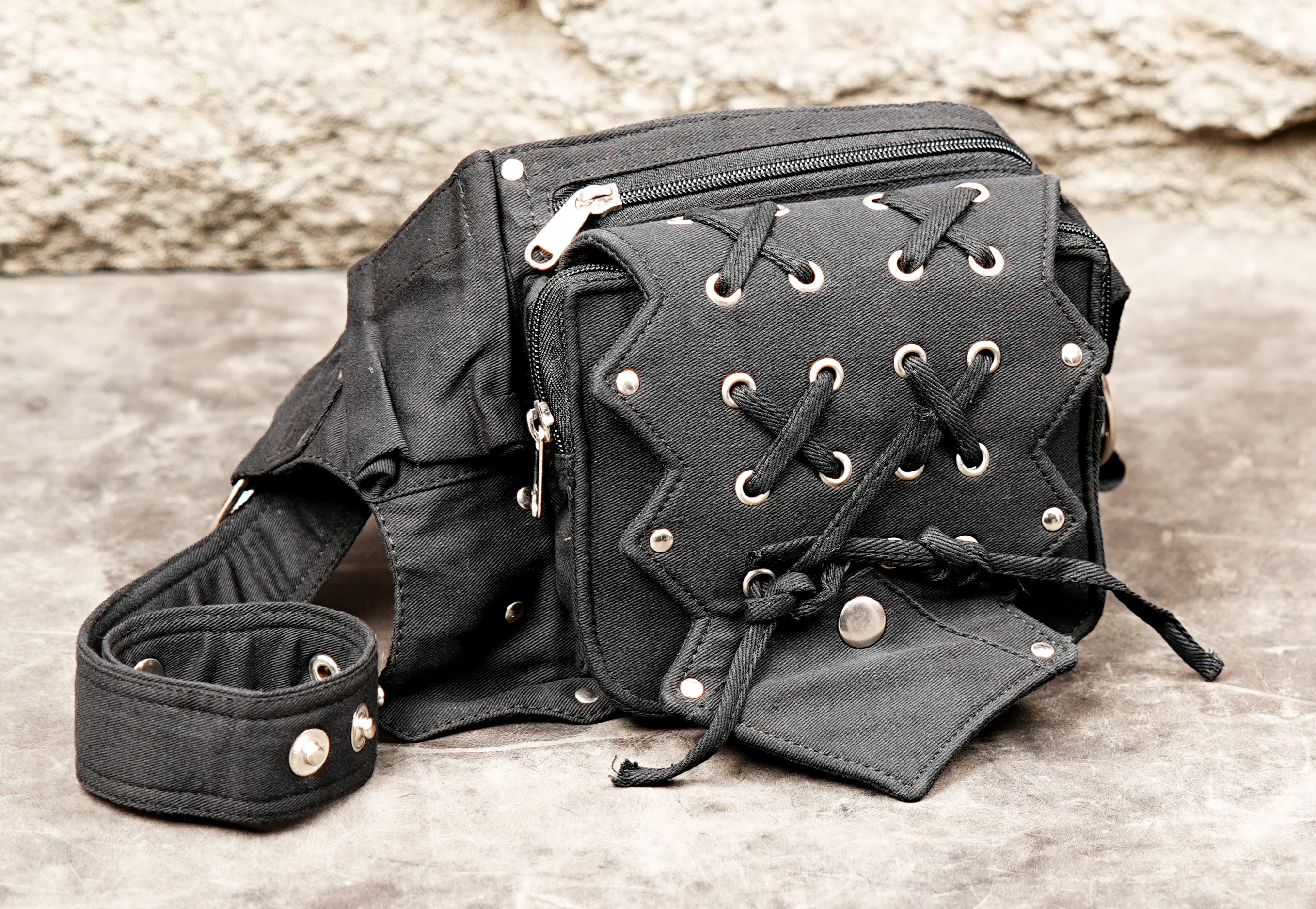 Durable canvas money belt with decorative lacing, seen from above.
