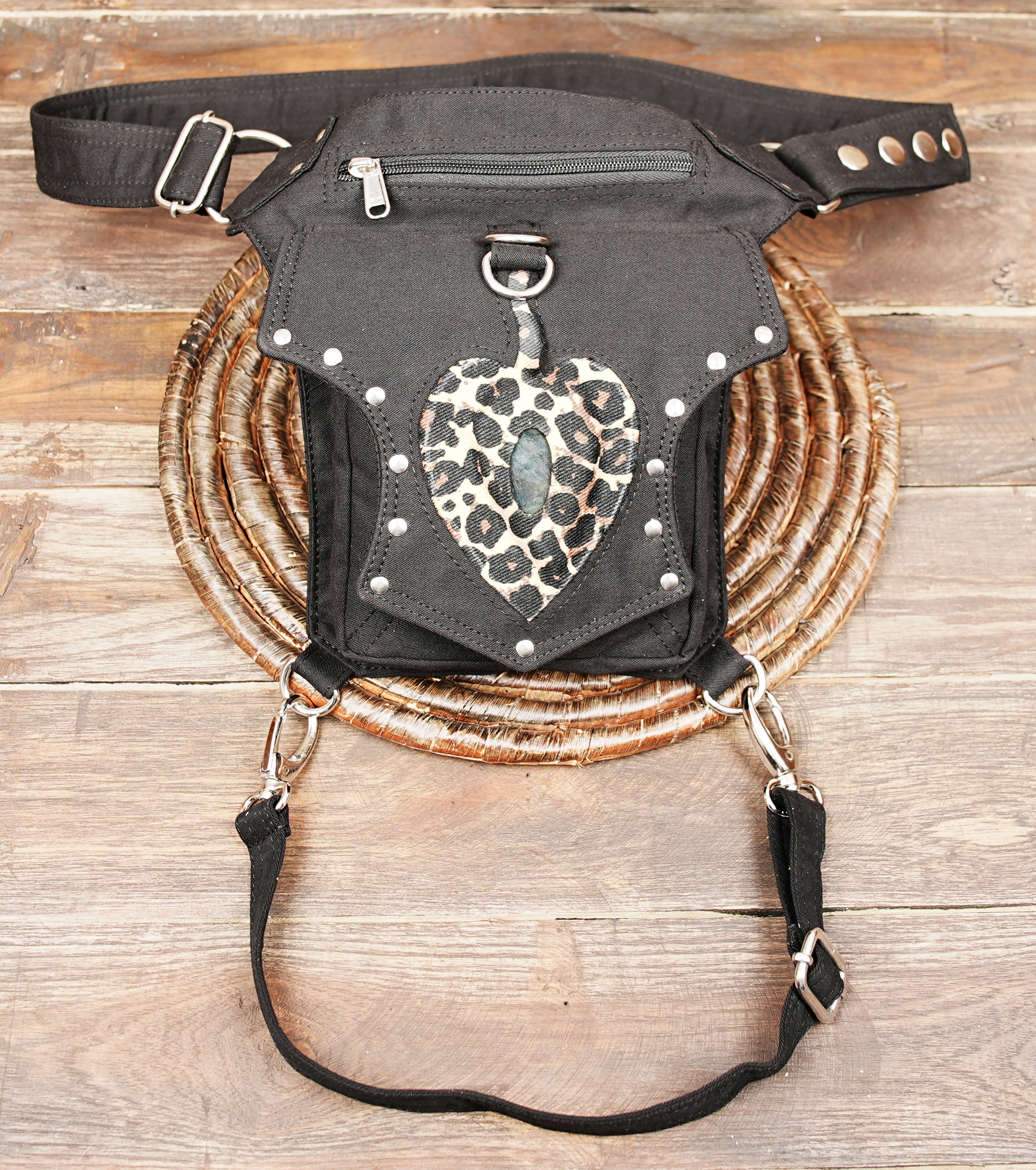 Rugged cotton thigh bag showcasing silver hardware and animal print accent