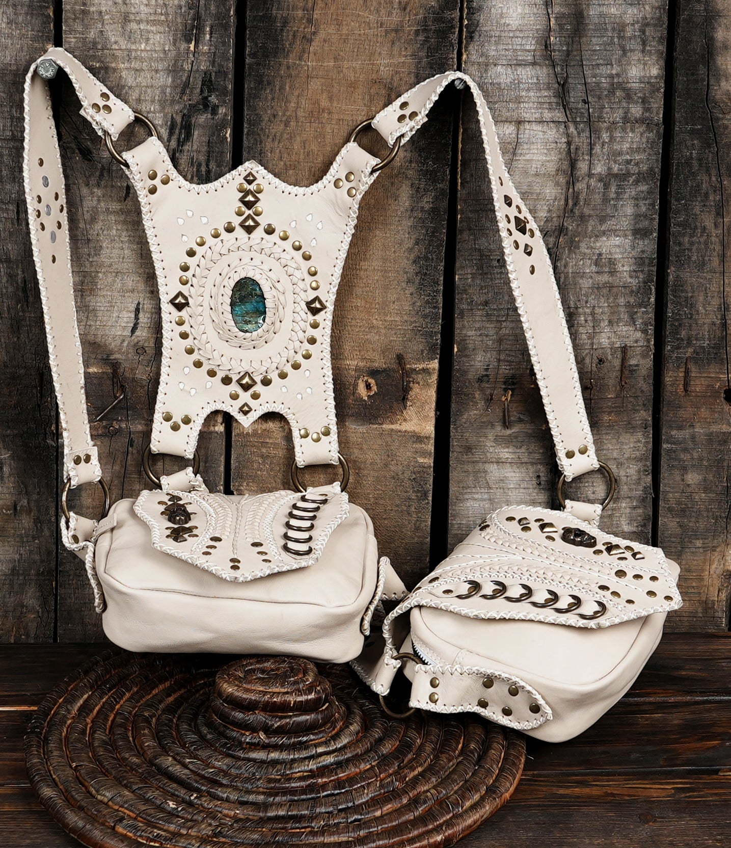 Leather holster bag with gemstone accent on wooden background