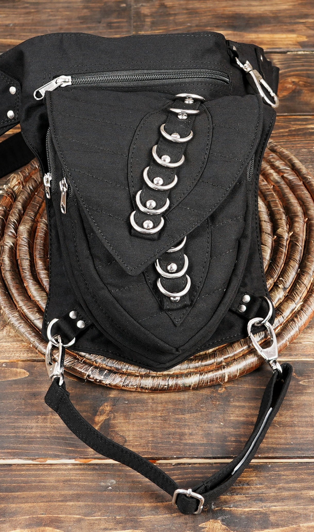 Black multi pocket festival fanny pack with thigh harness loop.