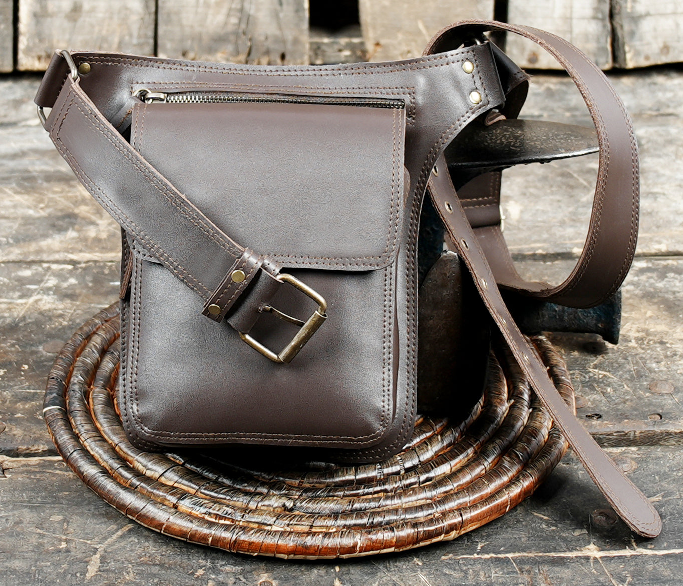 Rustic brown leather utility belt with front storage pouch