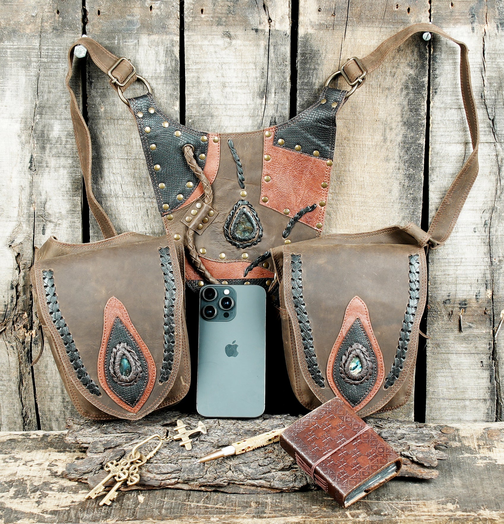 “Boho tribal leather holster with decorative stitching and natural stone inlay”