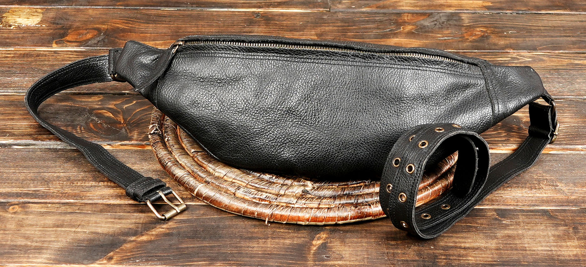 Artisan crafted black leather hip bag for festivals and daily use