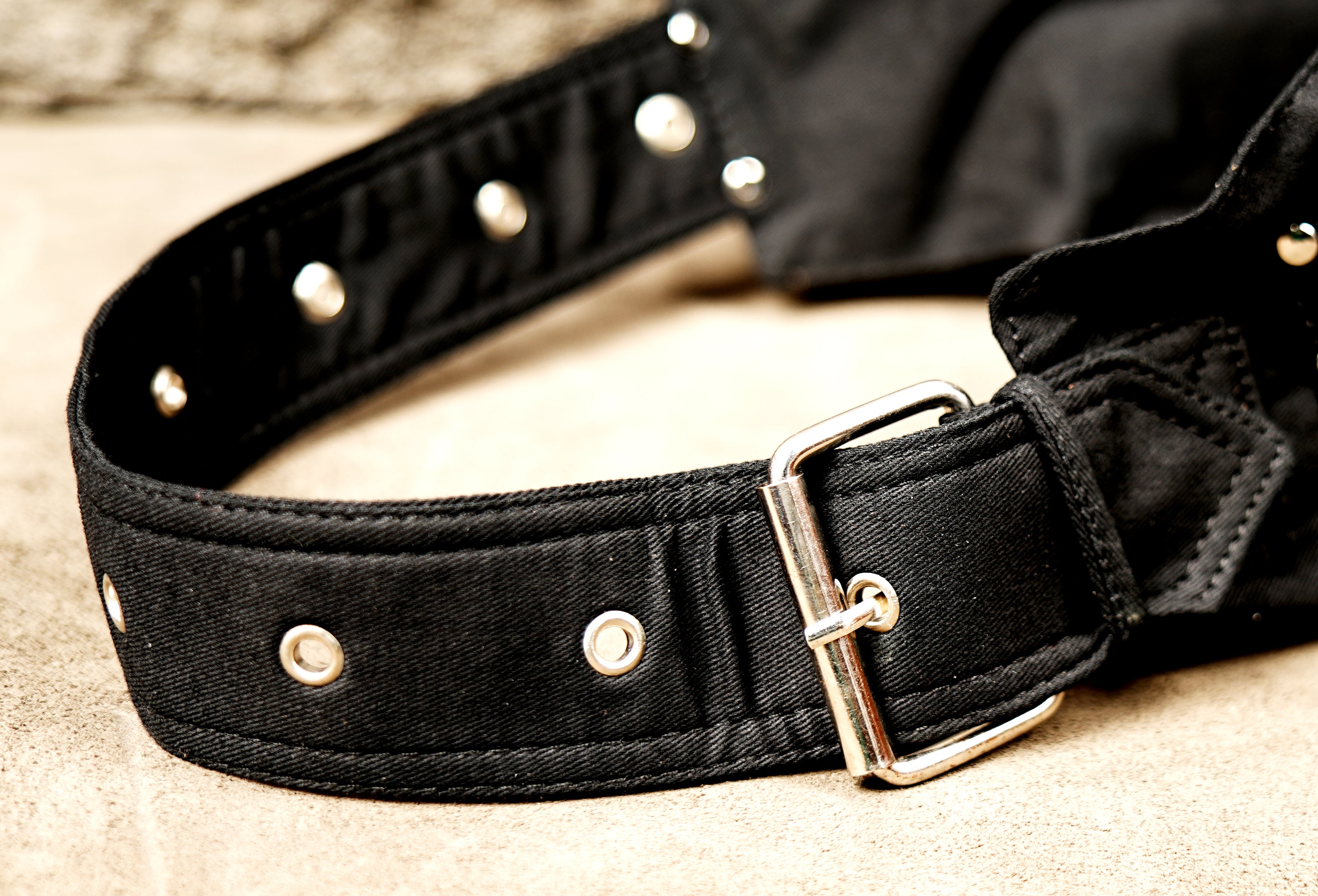 Rugged black multi-pocket pouch belt suitable for festivals and travel.