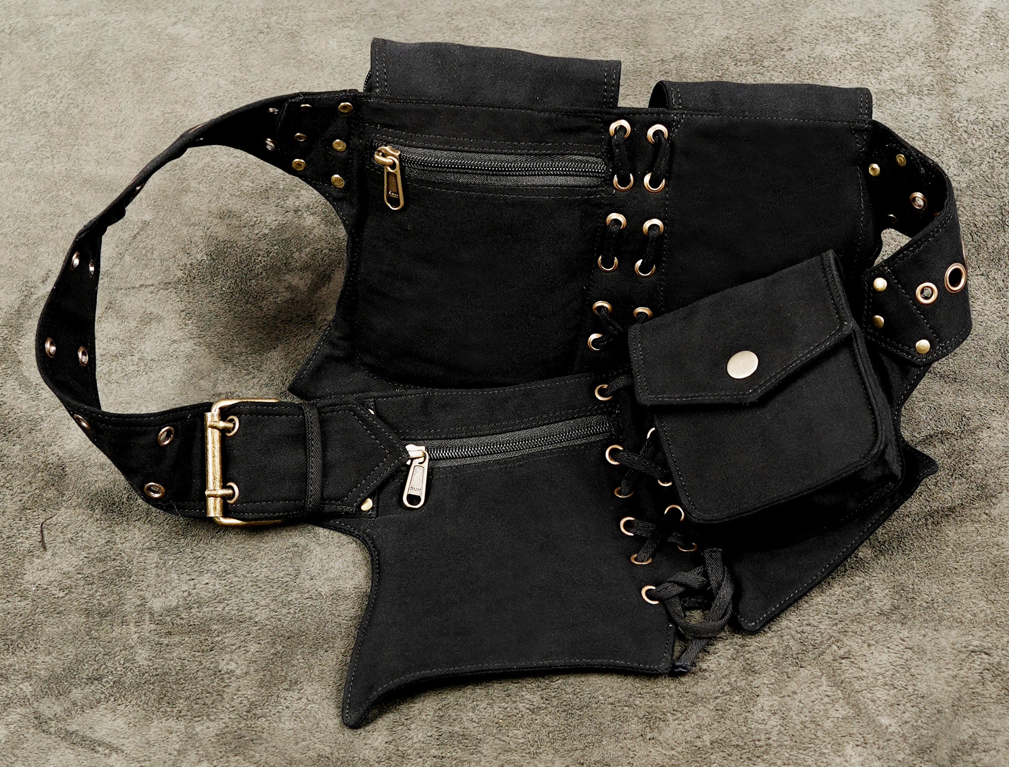 Black steampunk waist belt with zip pockets and decorative metal eyelets