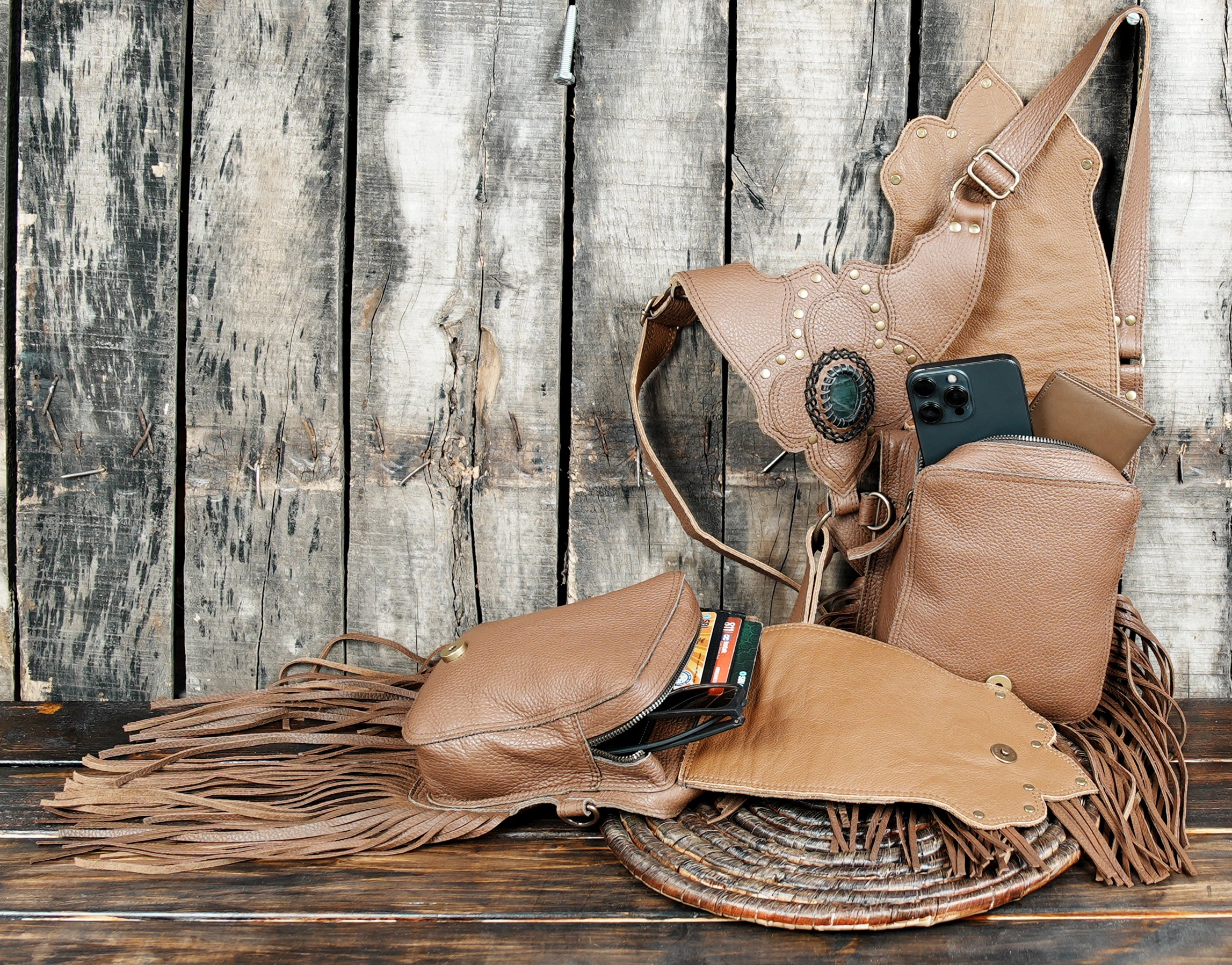 Artisan brown leather harness holster with floral inlay and gemstone