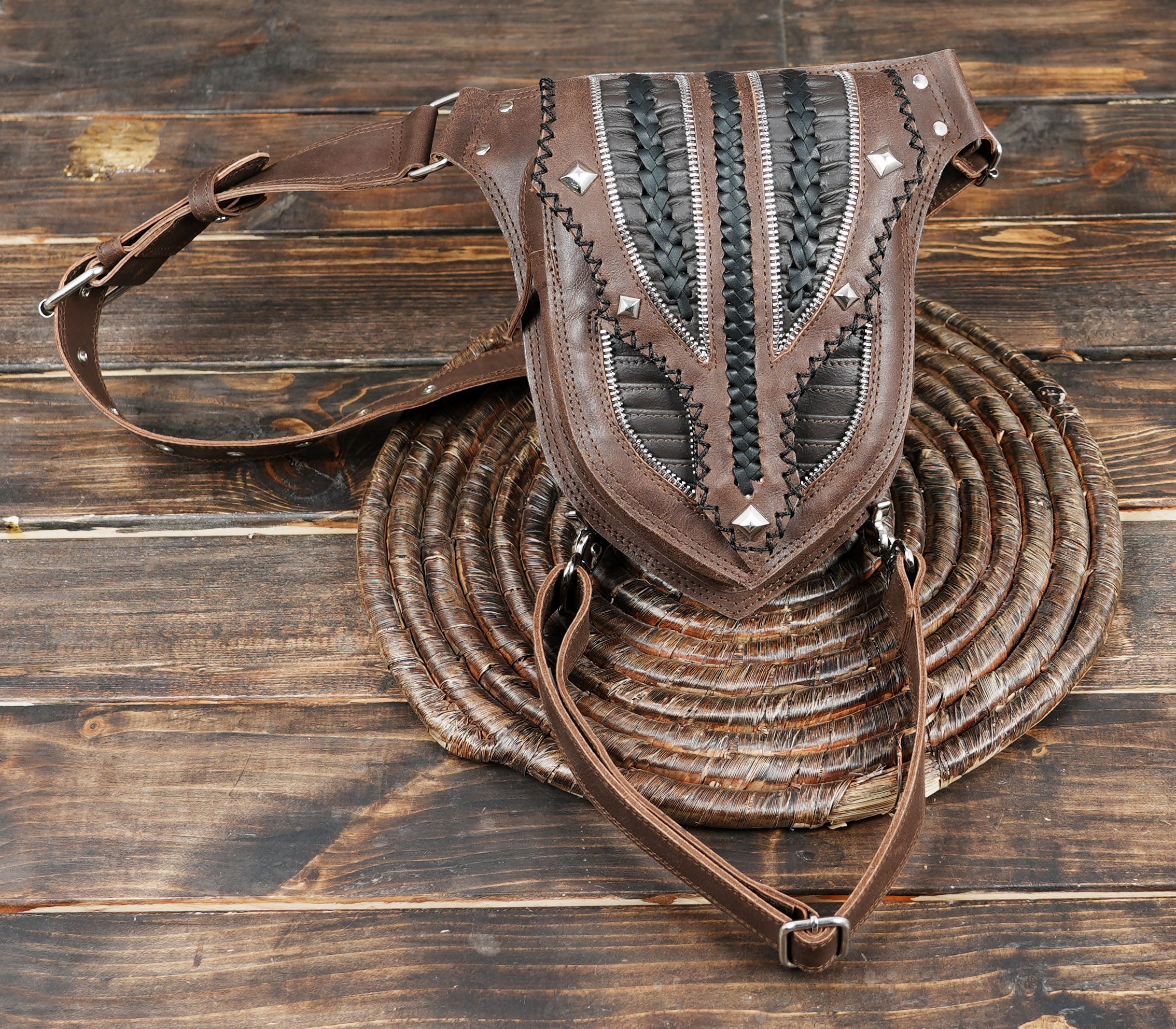 Boho leather thigh pouch belt with black woven centerpiece.