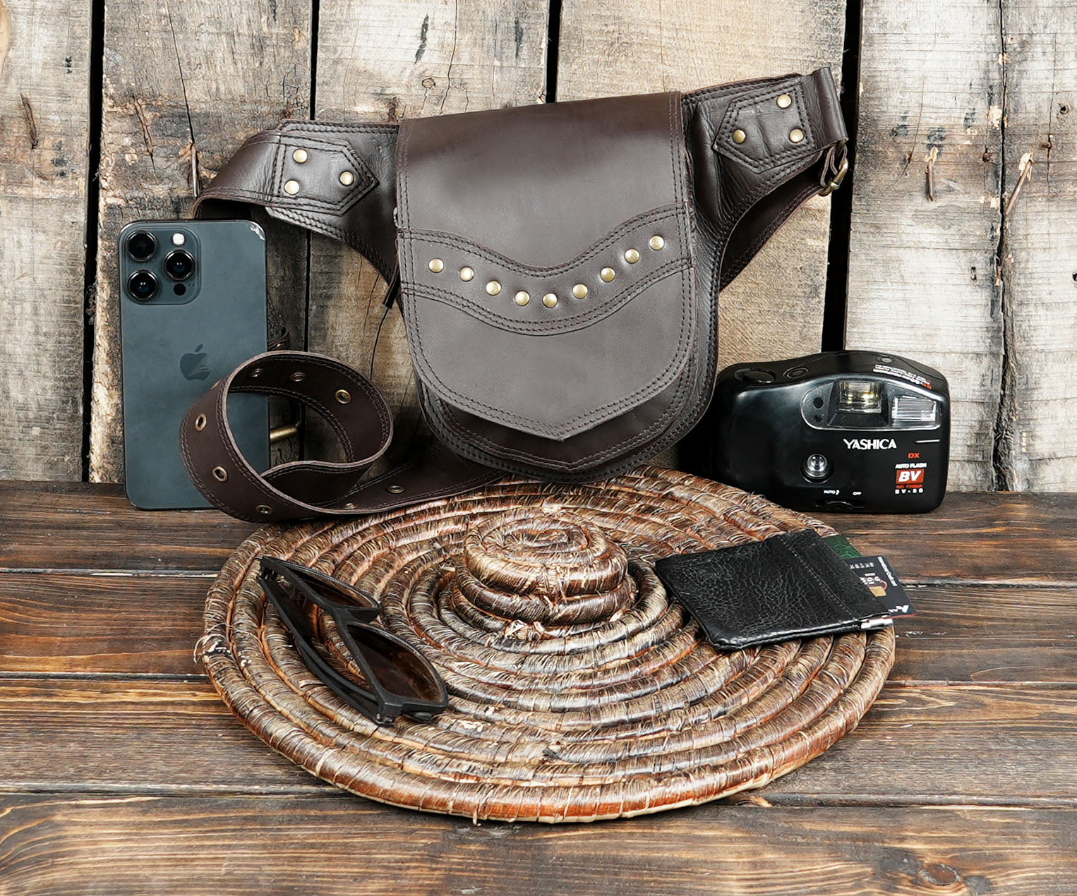 Festival ready brown leather hip bag with studded flap