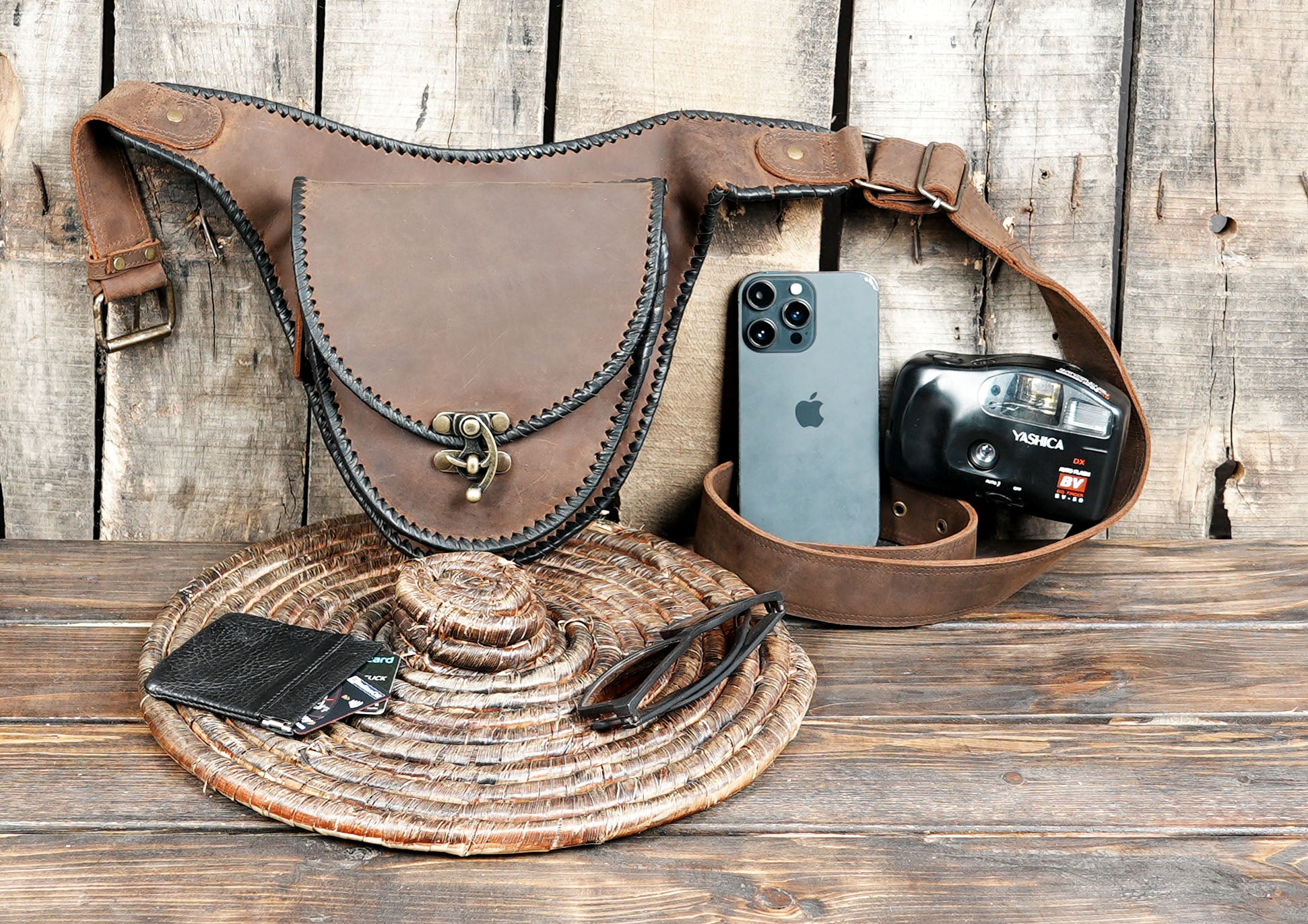 premium quality leather, it features a secure clasp closure with braided detailing around the flap, adding a rustic artisan touch.