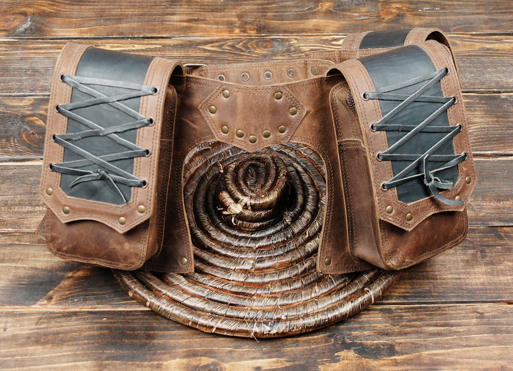Handmade brown leather waist belt with multiple utility pouches,