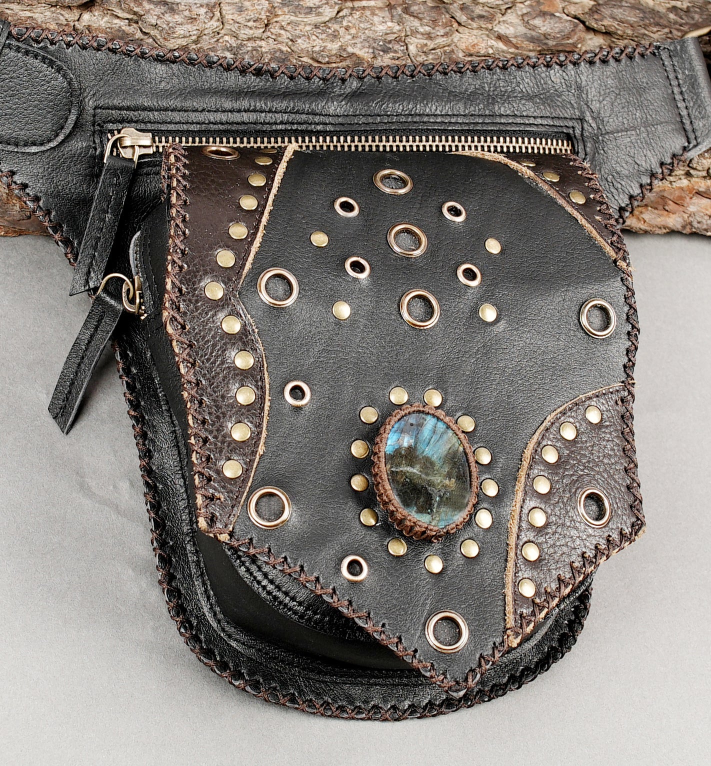 Black leather hip belt with gemstone inlay and rivet accents