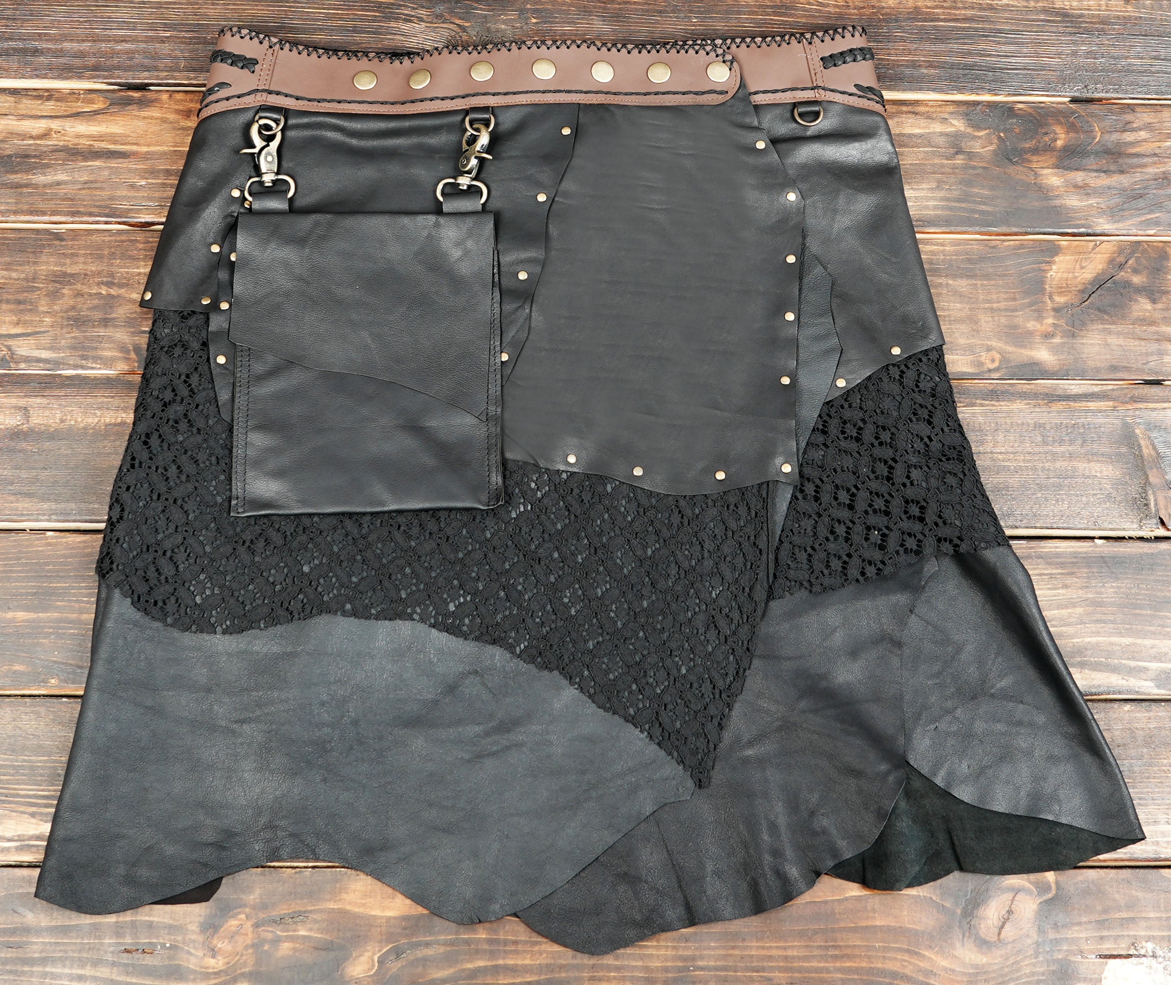 Decorative gemstone accent at the waistband adds a tribal and festival-inspired touch