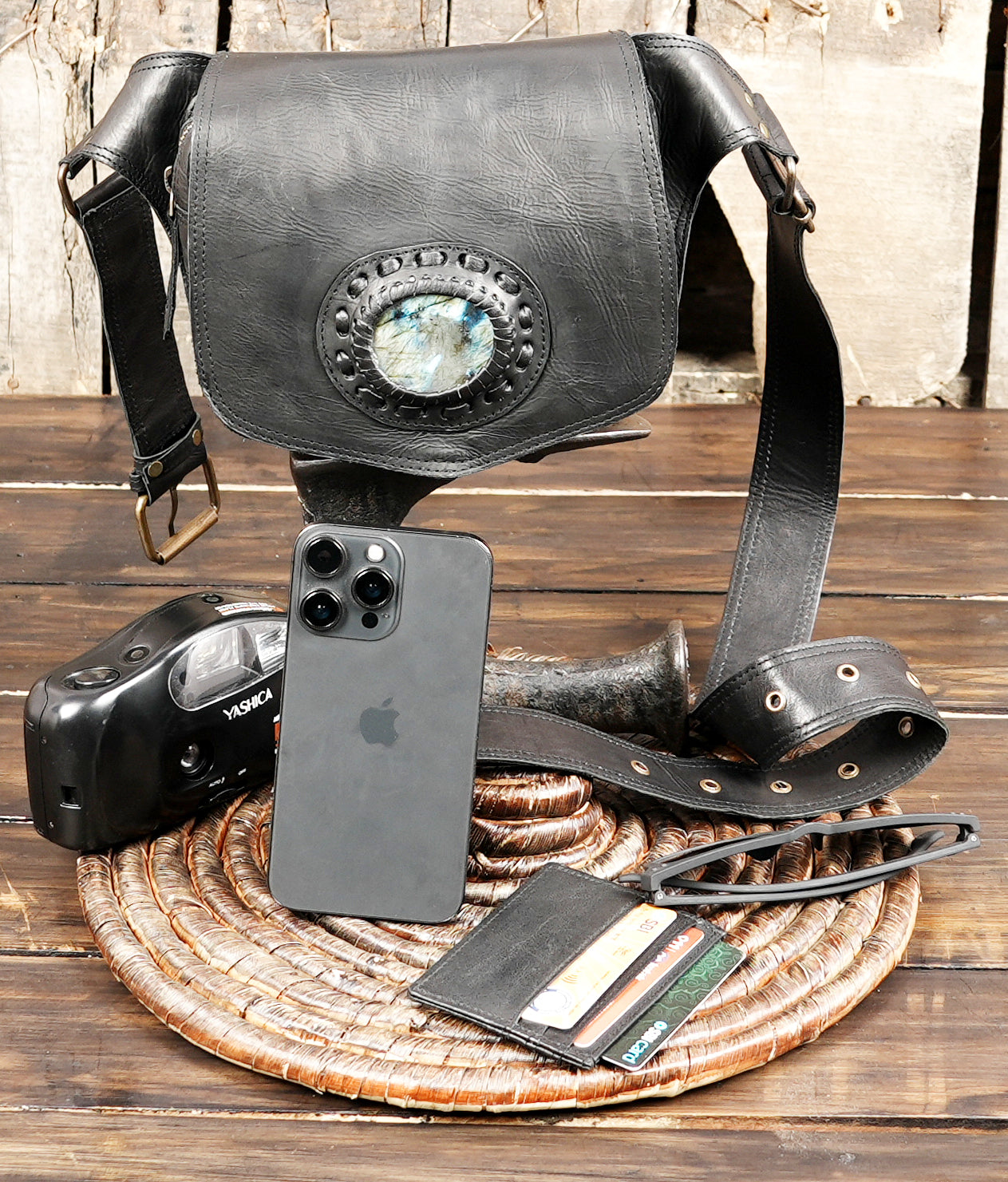 Artisan black leather belt pouch with polished stone centerpiece